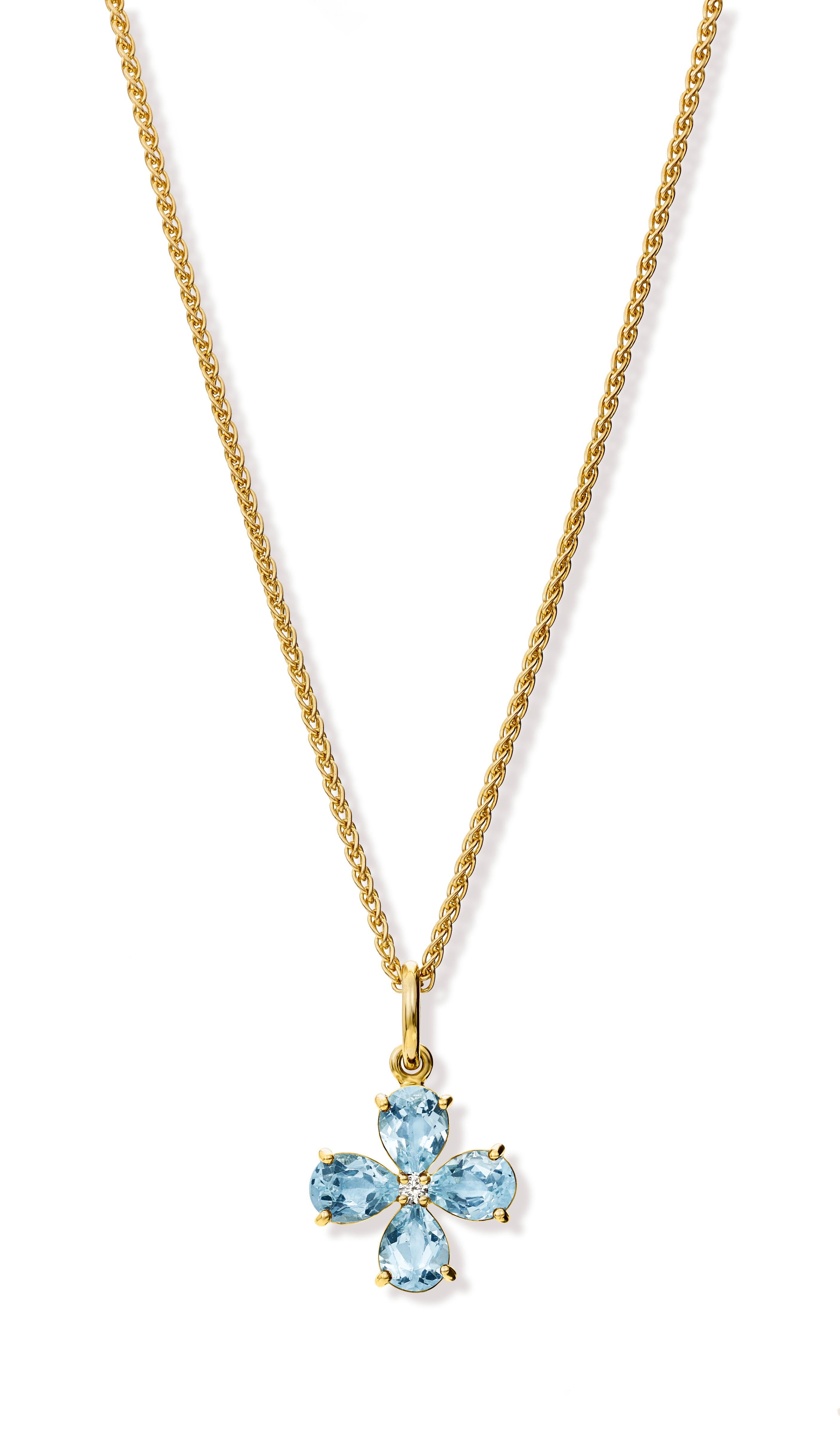 Medium Klover necklace pendant in 9 carat yellow gold set with blue topaz and a central diamond. Inspired by the four leaf Clover - the first leaf is for faith, the second is for hope, the third is for love, and the fourth is for luck.

Chain not
