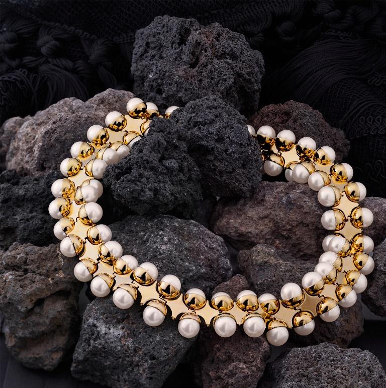 Cassandra Goad La Quintessenza necklace in 9ct yellow gold and set with pearls, graduated to lie flat around the neck. The Quintessence, meaning the five elements Earth, fire, water, air and ether, comes from a section of stone work (some volcanic