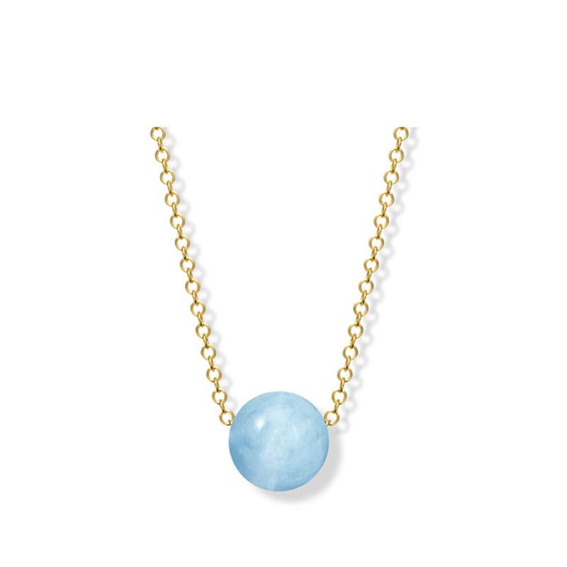 Pelota necklace in 9 carat yellow gold with aquamarine 10mm bead. The bead is on a 16