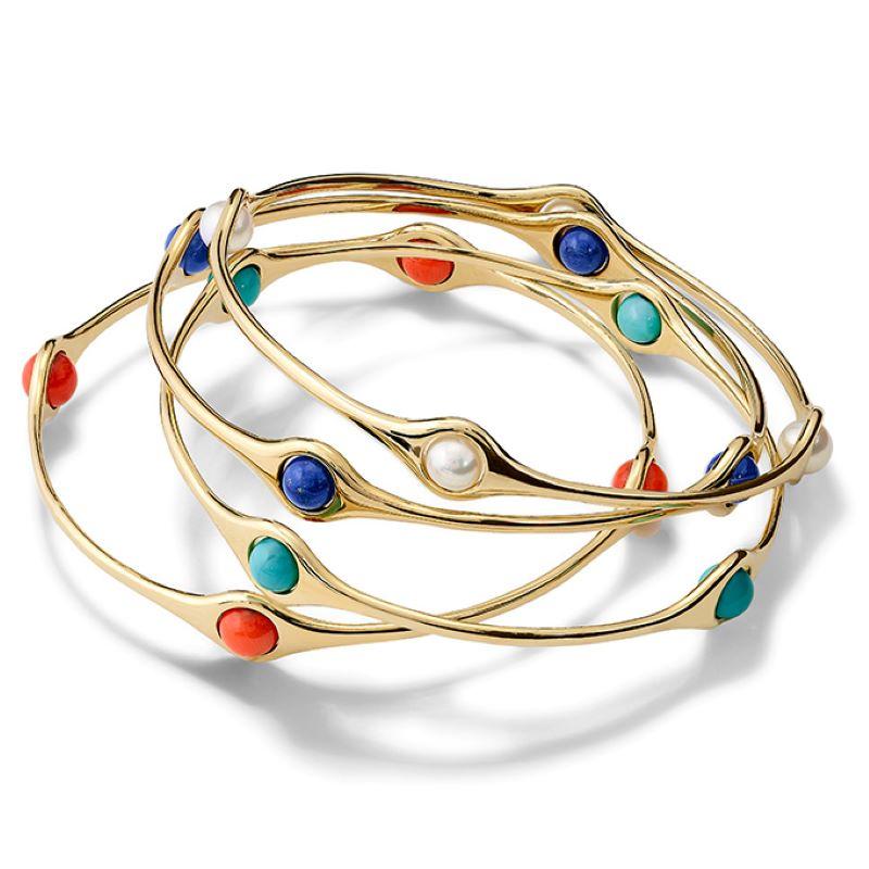 Persephone bangle in 9ct yellow gold set with four pearls. Inspired by the story of the Greek goddess Persephone who was so tempted by pomegranate seeds... From the Journey to Sicily.