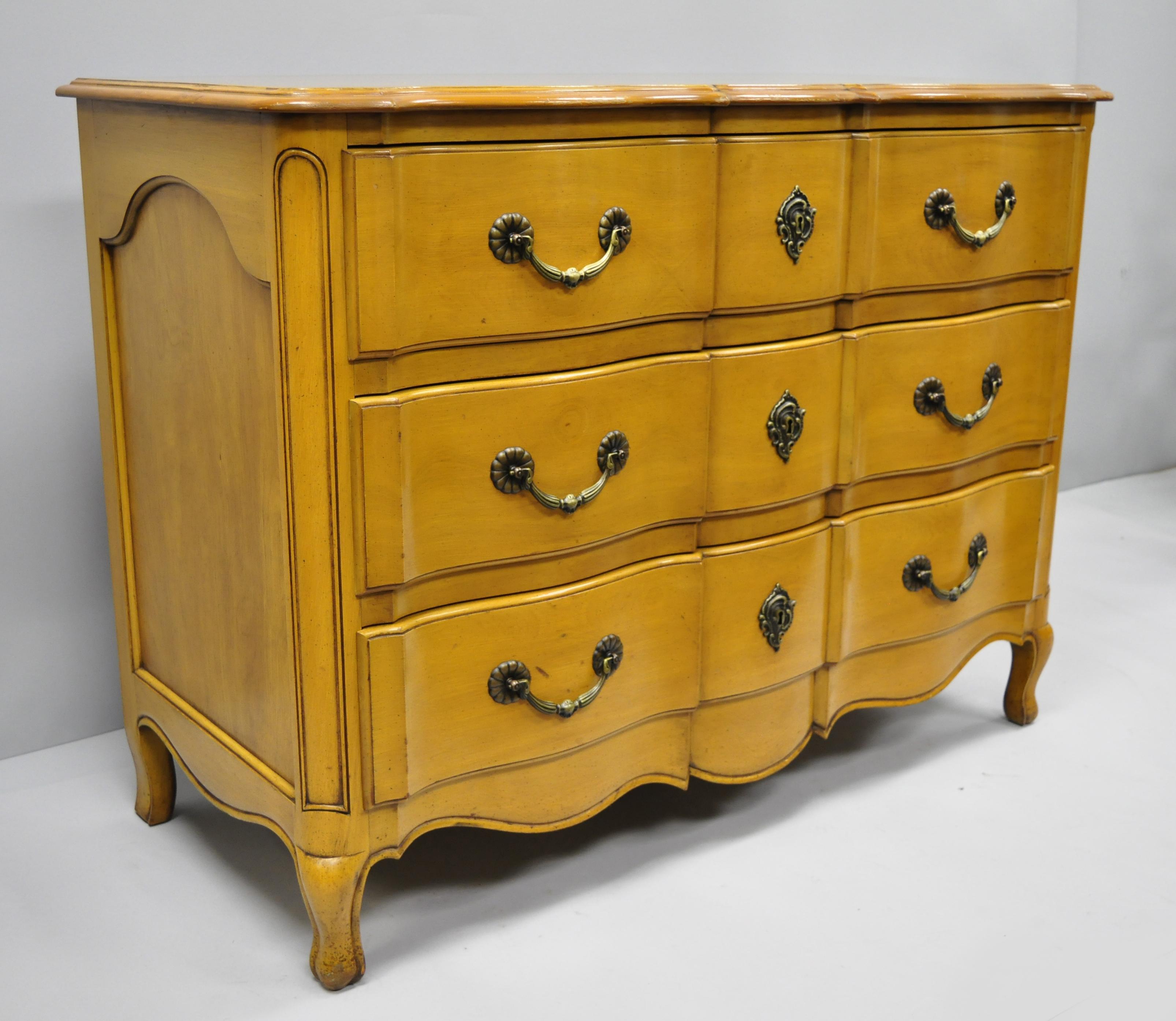 Three-drawer Country French commode by Cassard Romano. Item features solid wood construction, three dovetailed drawers, cabriole legs, solid brass hardware, carved sides, shaped top, signed 