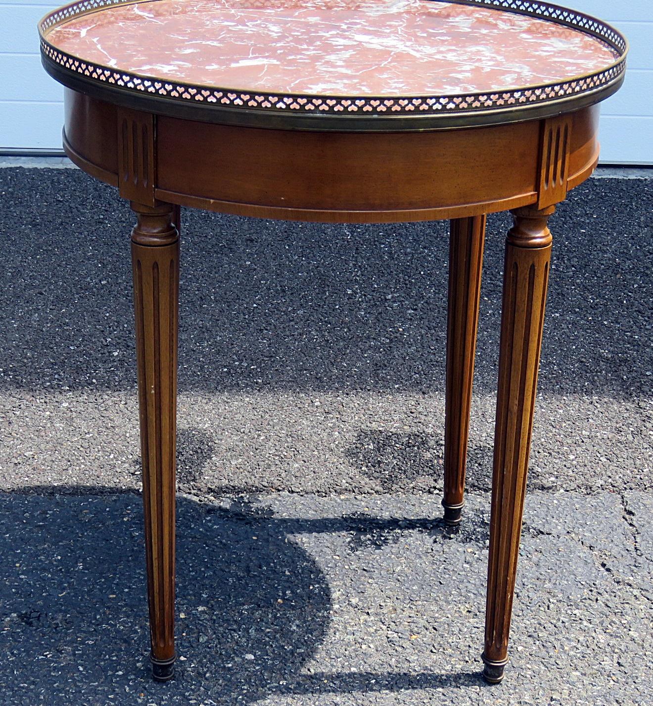 Cassard Romano Louis XVI style 1-drawer marble-top bouillotte table with a brass gallery.