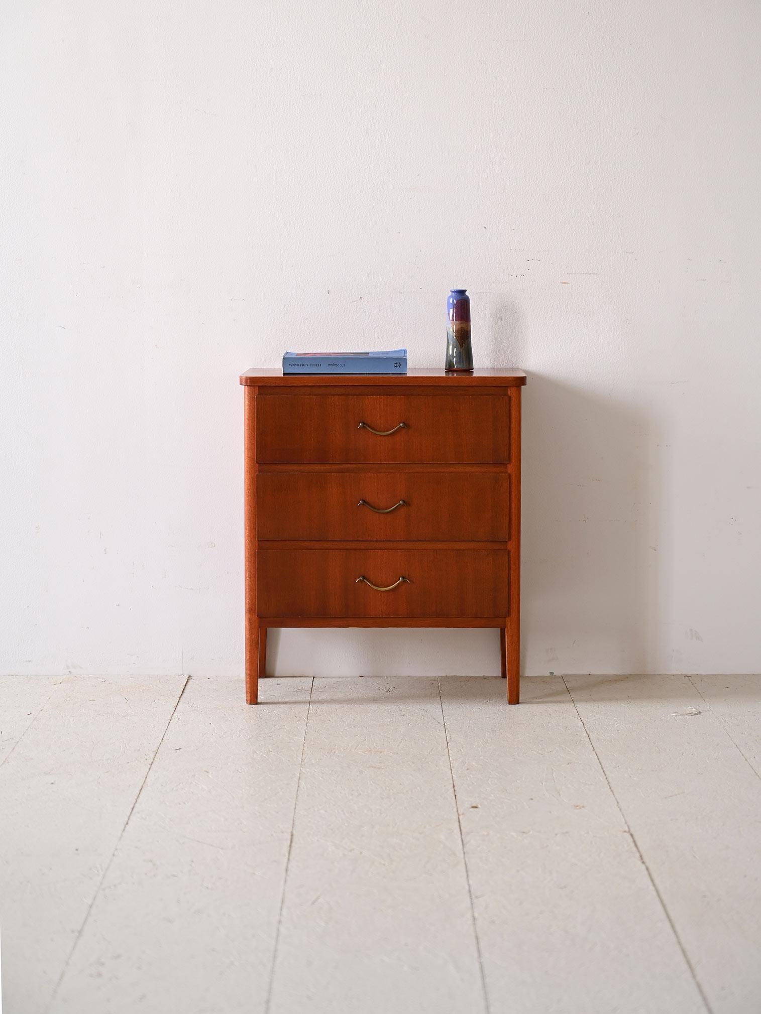 Cabinet with three drawers of vintage Scandinavian manufacture.

Perfect for adding a touch of mid-century style, this retro-flavored chest of drawers is perfect for use as a nightstand in the bedroom.
The understated and elegant structure is