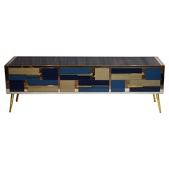 Modern Italian chest of drawers in sapphire blue glass, mirror, and brass