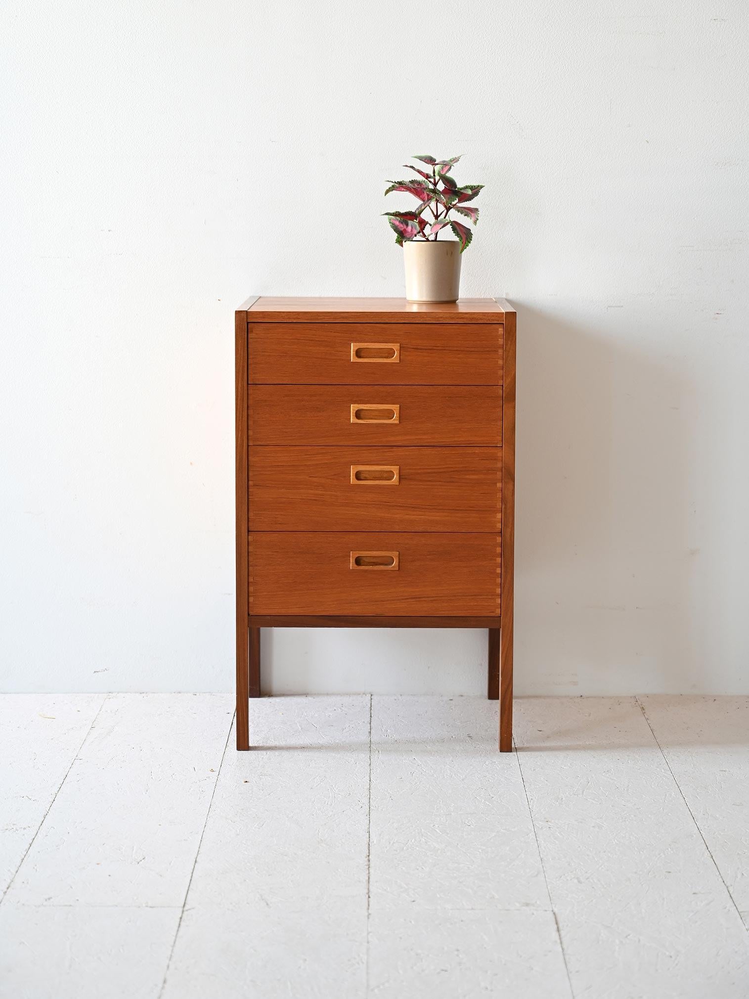 Swedish modern antique cabinet consisting of 4 drawers with a carved wooden handle.The long, squared legs echo the strong, modern lines of the frame. 

Good conditions. Potrebbe presentare dei segni del tempo. Please pay attention to the