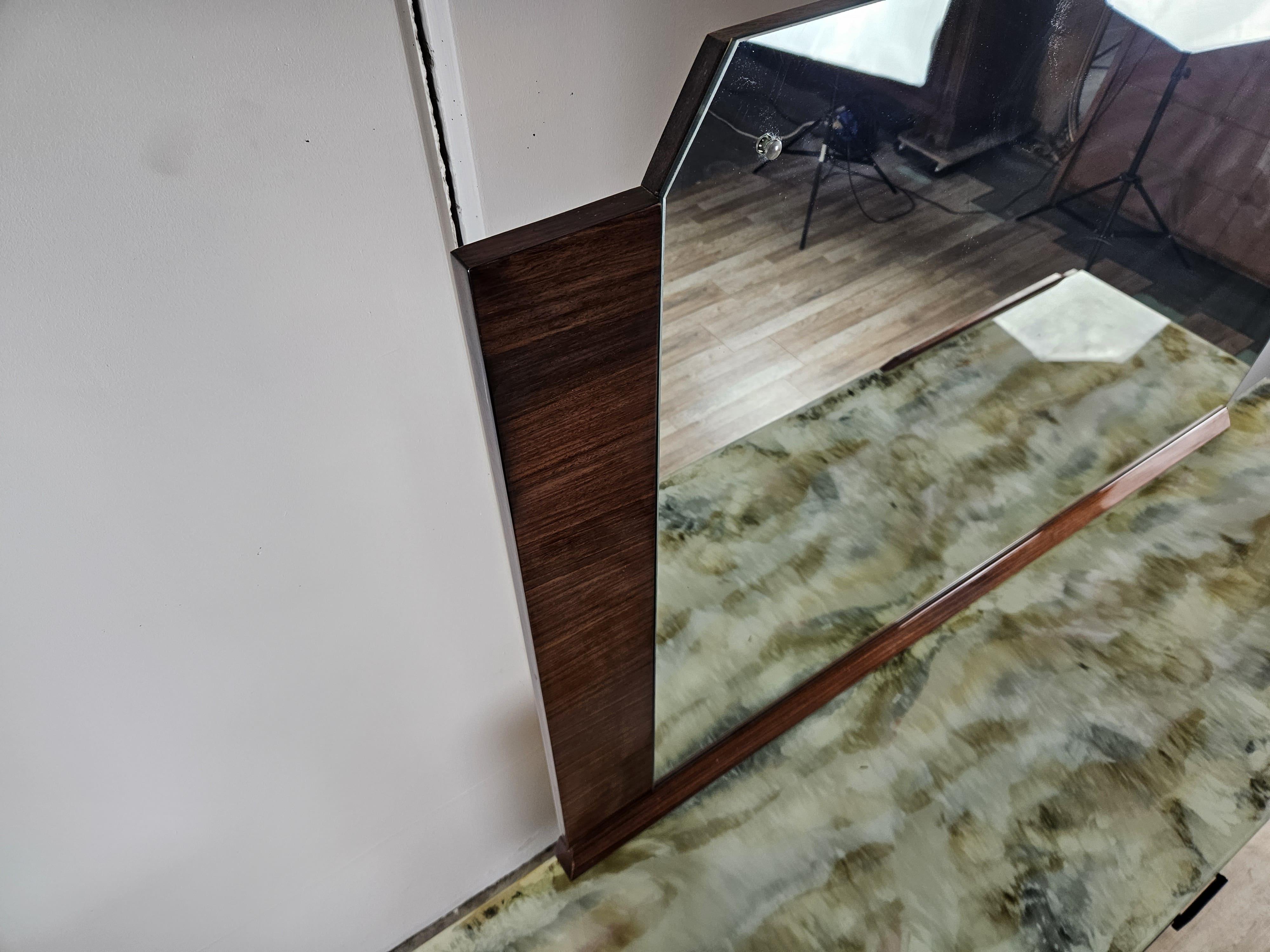Elegant bedroom cabinet from the early 1960s, with teak wood-paneled frame enhanced by glass decorated with various colors and a large geometric mirror.

The cabinet can be used in a variety of settings, from the bedroom to the living room or in the