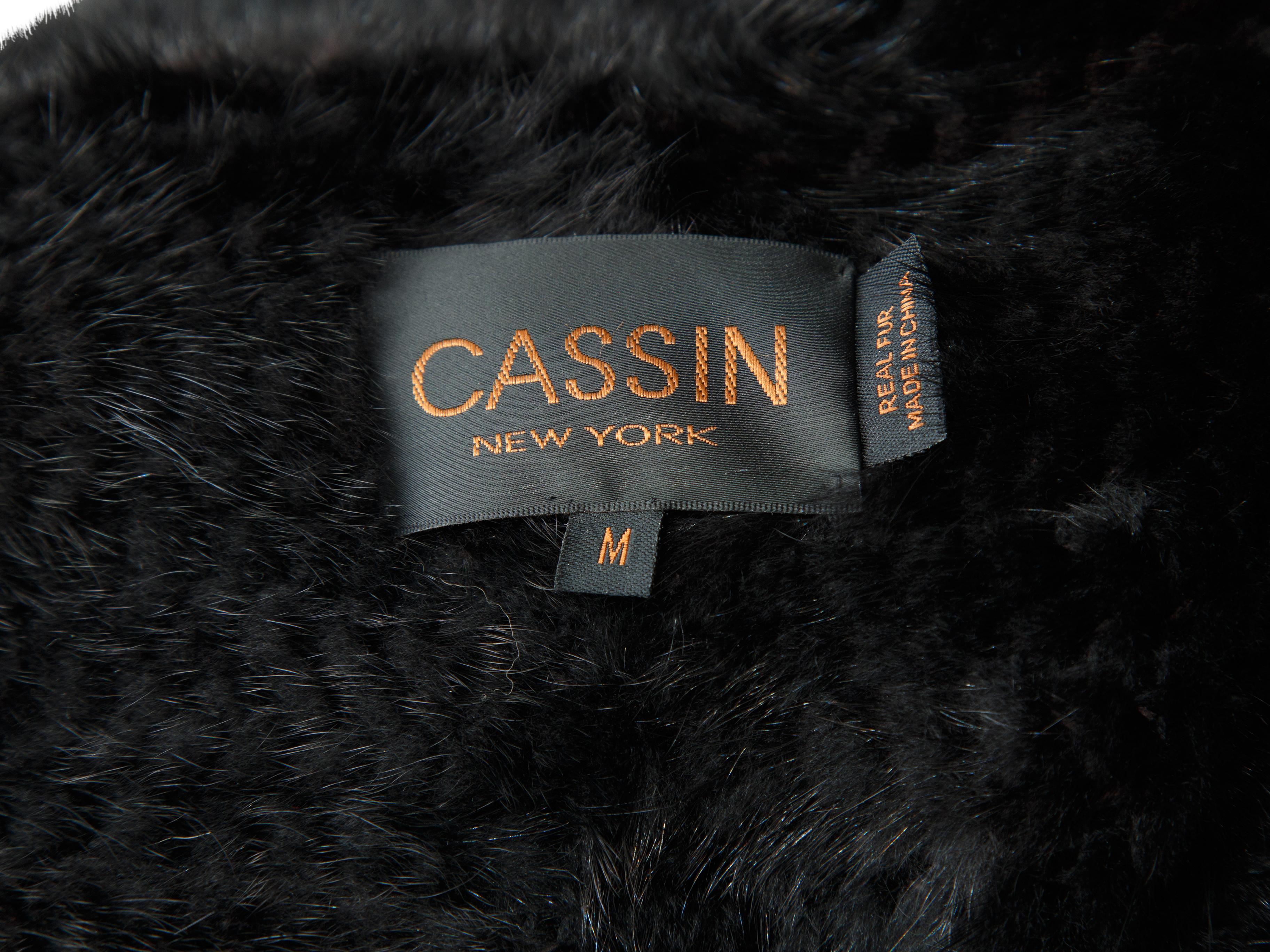 Product details:  Black mink fur vest by Cassin.  Round collar.  Sleeveless.  Concealed front closure.  40