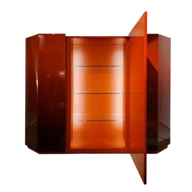 A design storage cabinet, symbol of a modern-day timeless classic with sleek uncluttered lines upon which the Japanese architect Takahama projects a deep relationship with the past, recalling the ancient art of lacquer finishes. This Cabinet is in