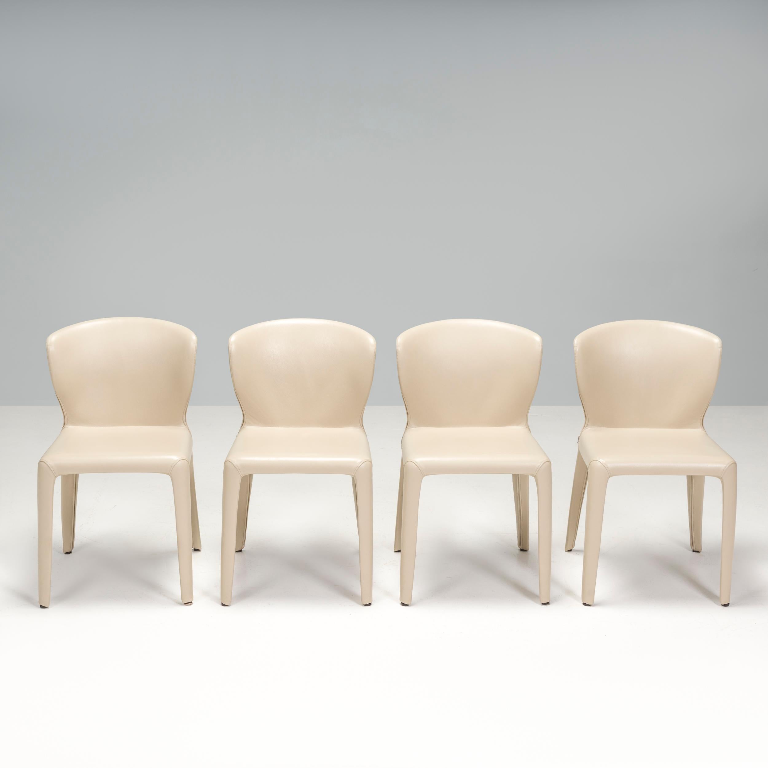 Designed by Hannes Wettstein for Cassina in 2003, these 367 Hola dining chairs have a sleek, contemporary silhouette.
 
The set of four chairs are in excellent condition and are fully upholstered in cream leather.
 
Featuring a curved wingback, the
