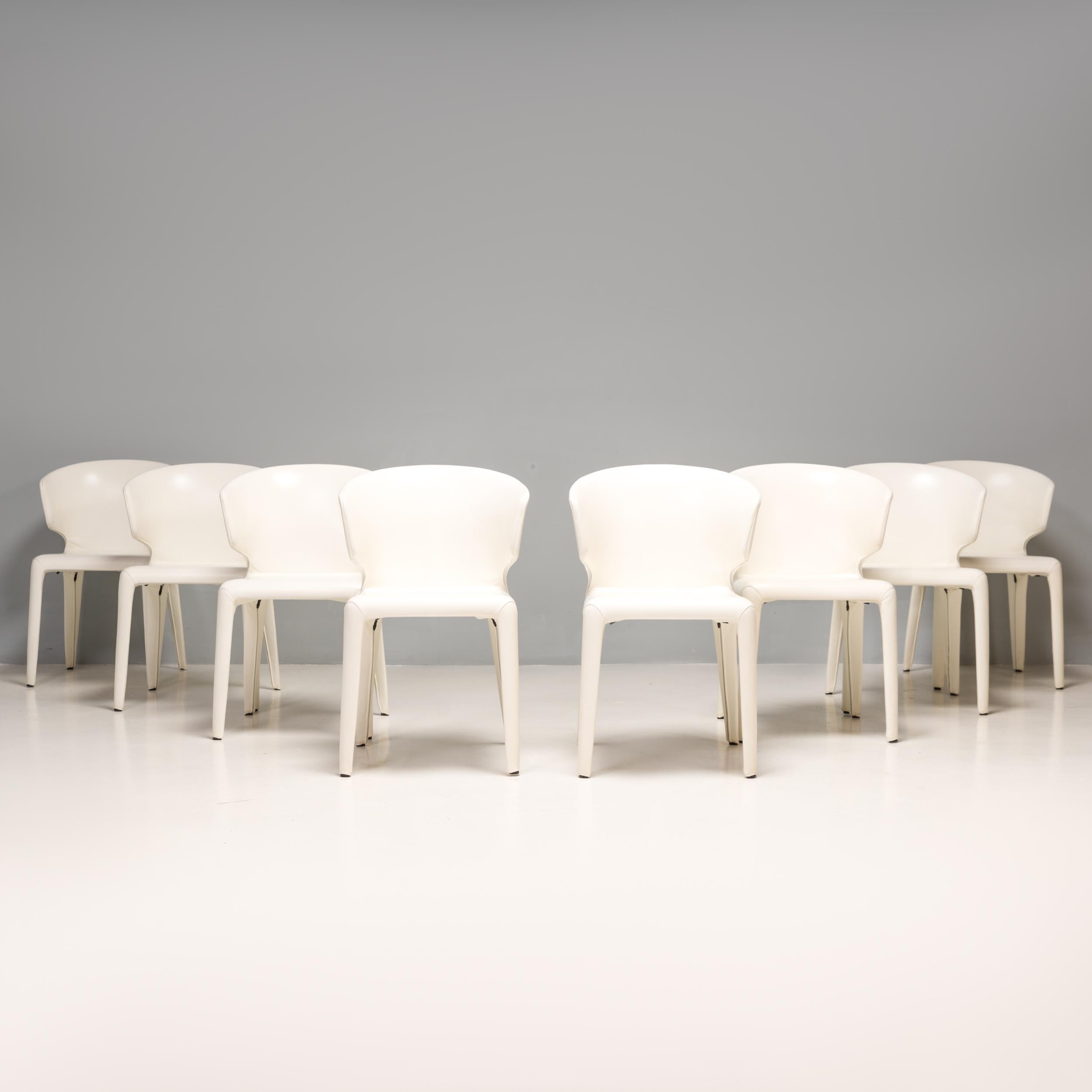 Designed by Hannes Wettstein for Cassina in 2003, these 367 Hola dining chairs have a sleek, contemporary silhouette.
 
The set of eight chairs are in excellent, nearly new condition and are fully upholstered in white leather.
 
Featuring a curved