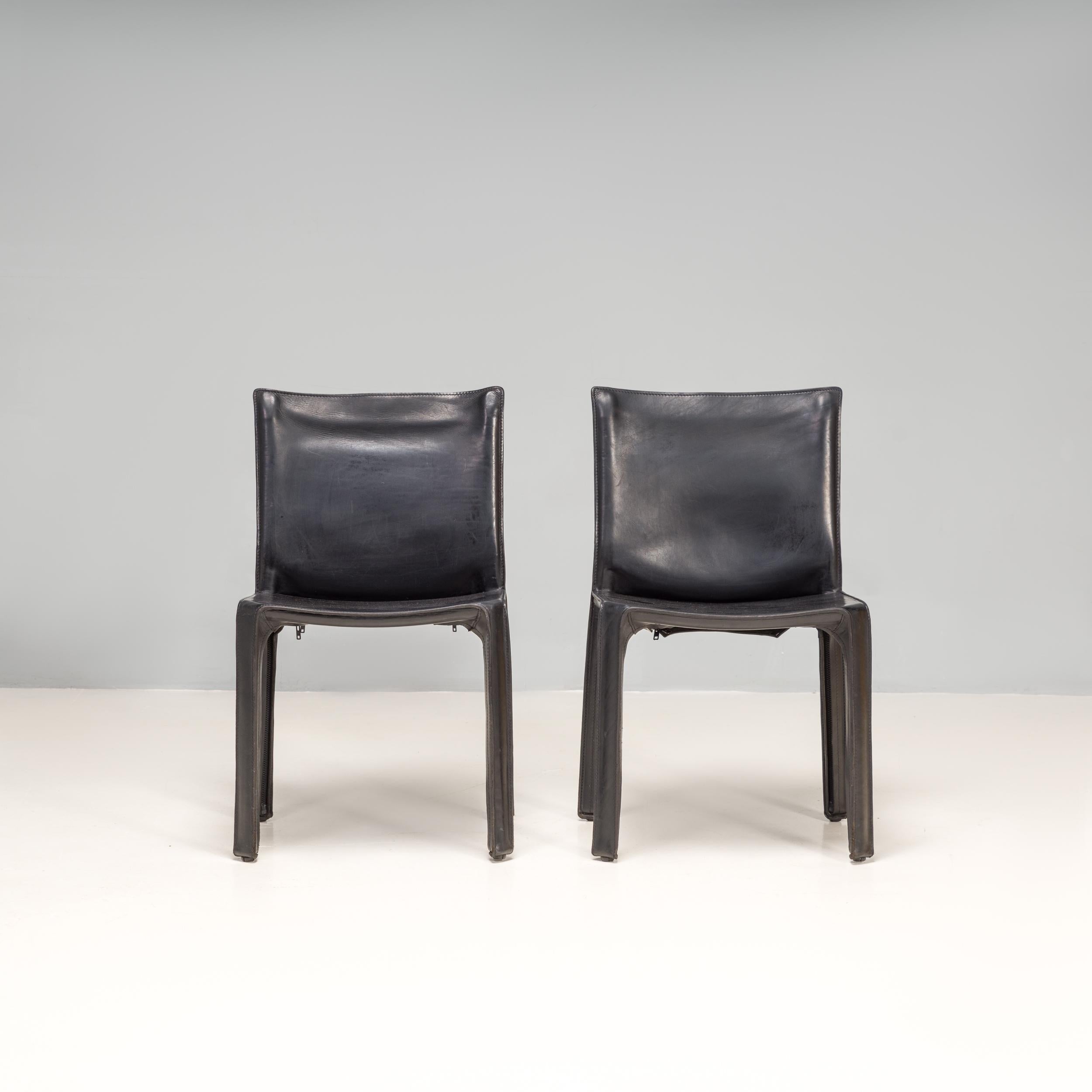 Designed by Mario Bellini in 1977, the cab dining chairs have since become a signature piece in the Cassina furniture collection.

These original 1970s dining chairs are constructed from a steel frame and are covered in black leather upholstery,