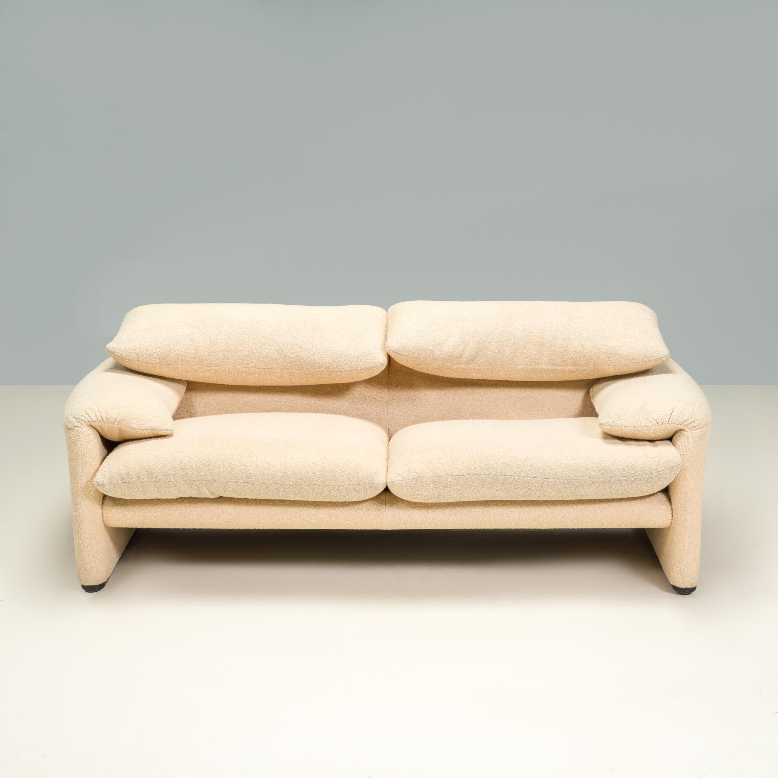 Originally designed by Vico Magistretti for Cassina in 1973, the Maralunga sofa has become a true design icon.

Upholstered in soft textured cream boucle fabric, the sofa features the signature adjustable headrests and folded armrests, while two