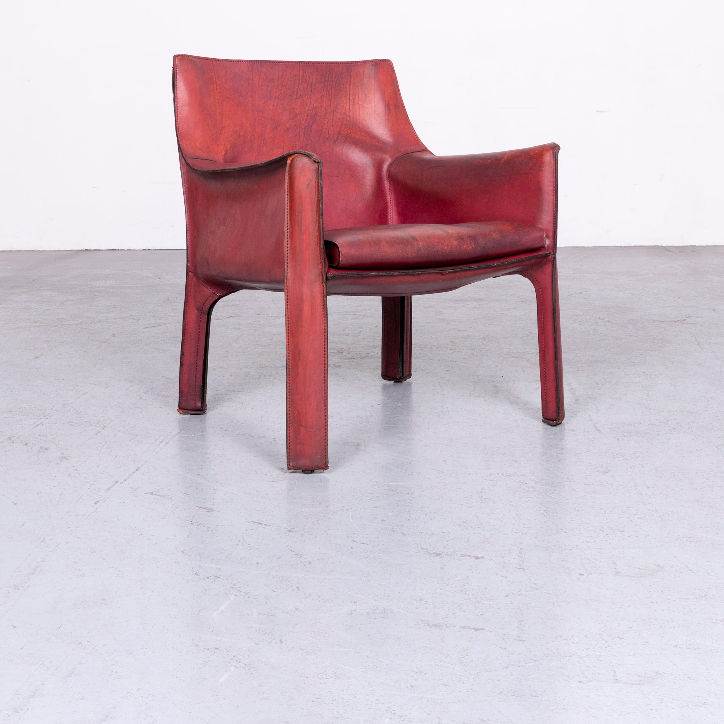 We bring to you a cassina cab 414 vintage leather armchair red by Mario Belinni 1970-1979.