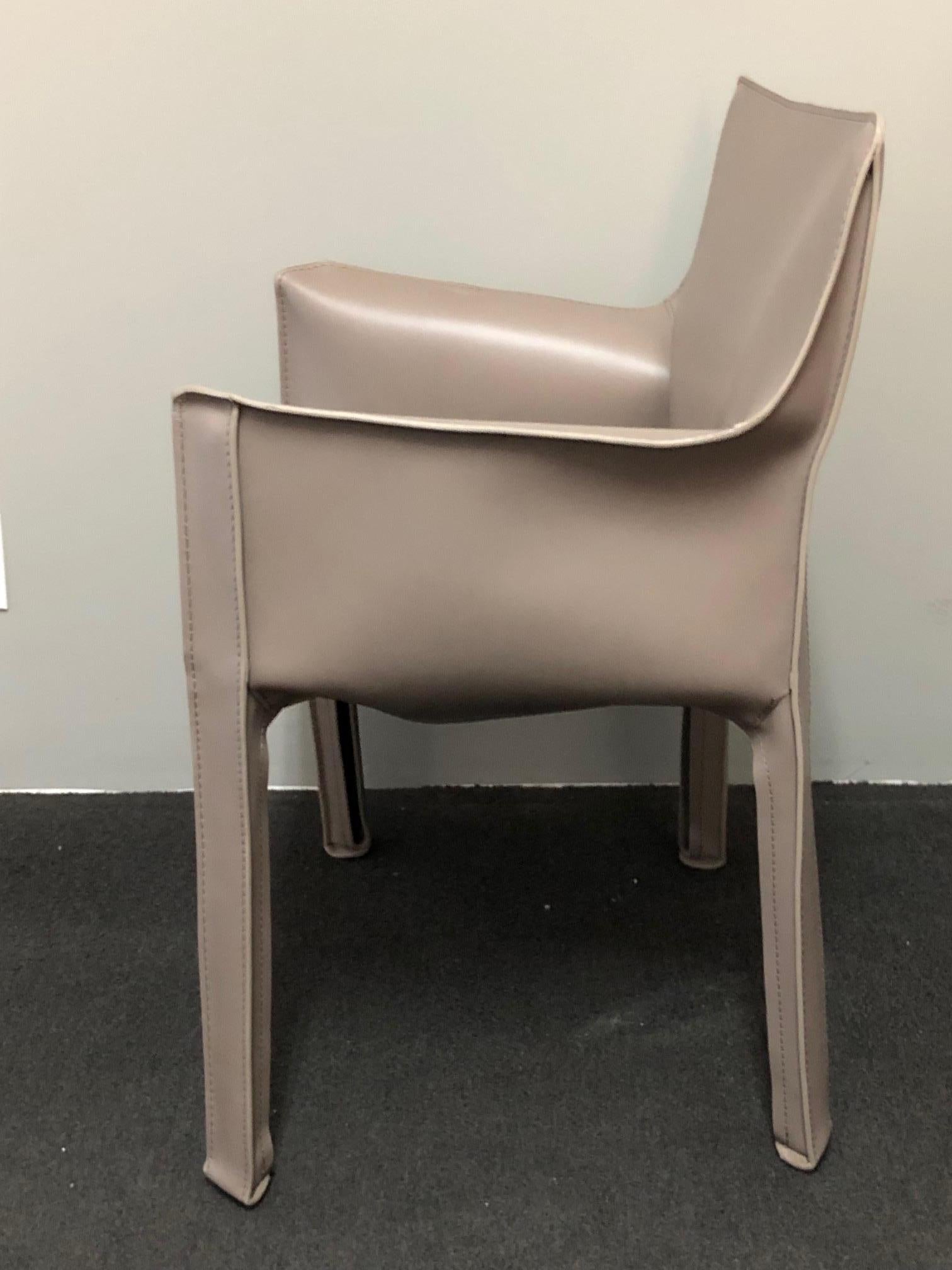 Armchair with enamelled steel frame. The seat is padded with polyurethane foam. Leather upholstery zippered over the frame, in taupe colour.
CAB was designed in answer to deep questions regarding the exact nature of the semantic meaning of