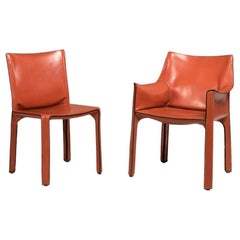 Deux fauteuils et huit chaises Cassina Cab Model 