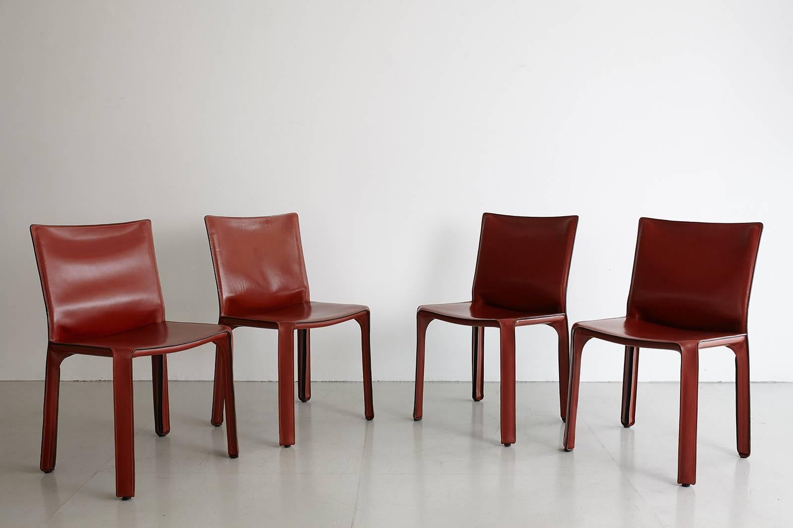 Classic leather cab chairs by Mario Bellini for Cassina. Great patina to leather. Excellent vintage condition. Set of four available. Priced individually.