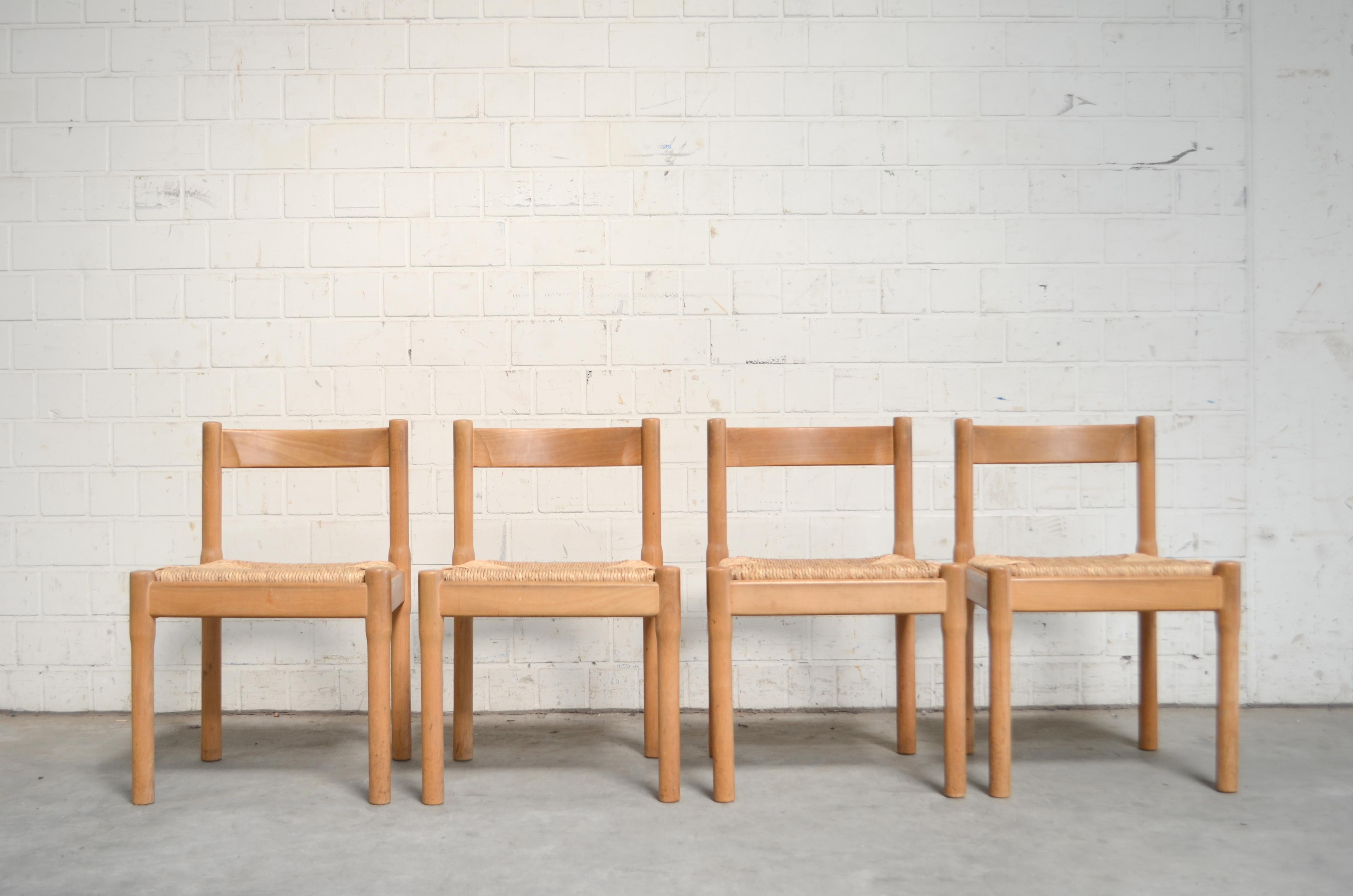 Cassina Model Carimate chair by Vico Magistretti.
Comfortable dining chairs. Made of beechwood and papercord.
Set of 4.
 