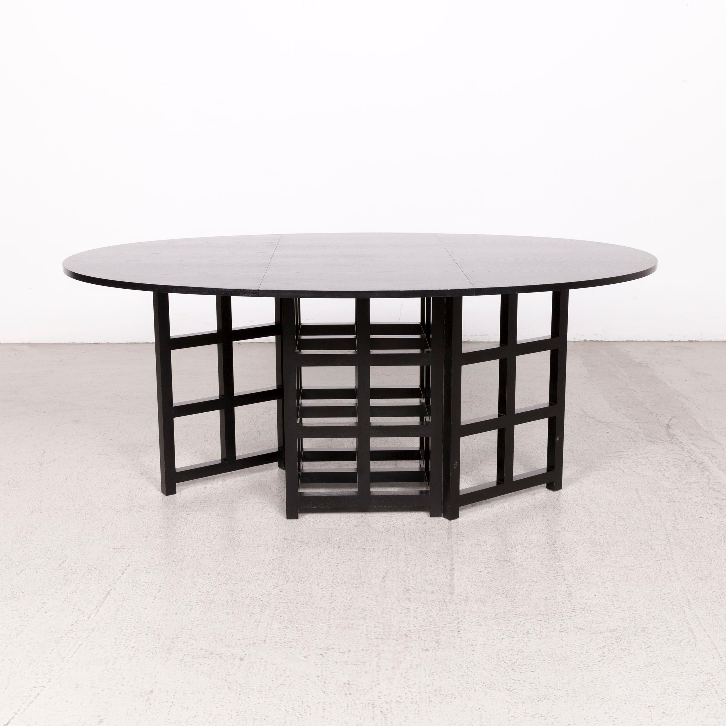 We bring to you a Cassina d.s. 1 designer wood dining table black.

Product measurements in centimeters:

Depth 125
Width 177
Height 75.





     