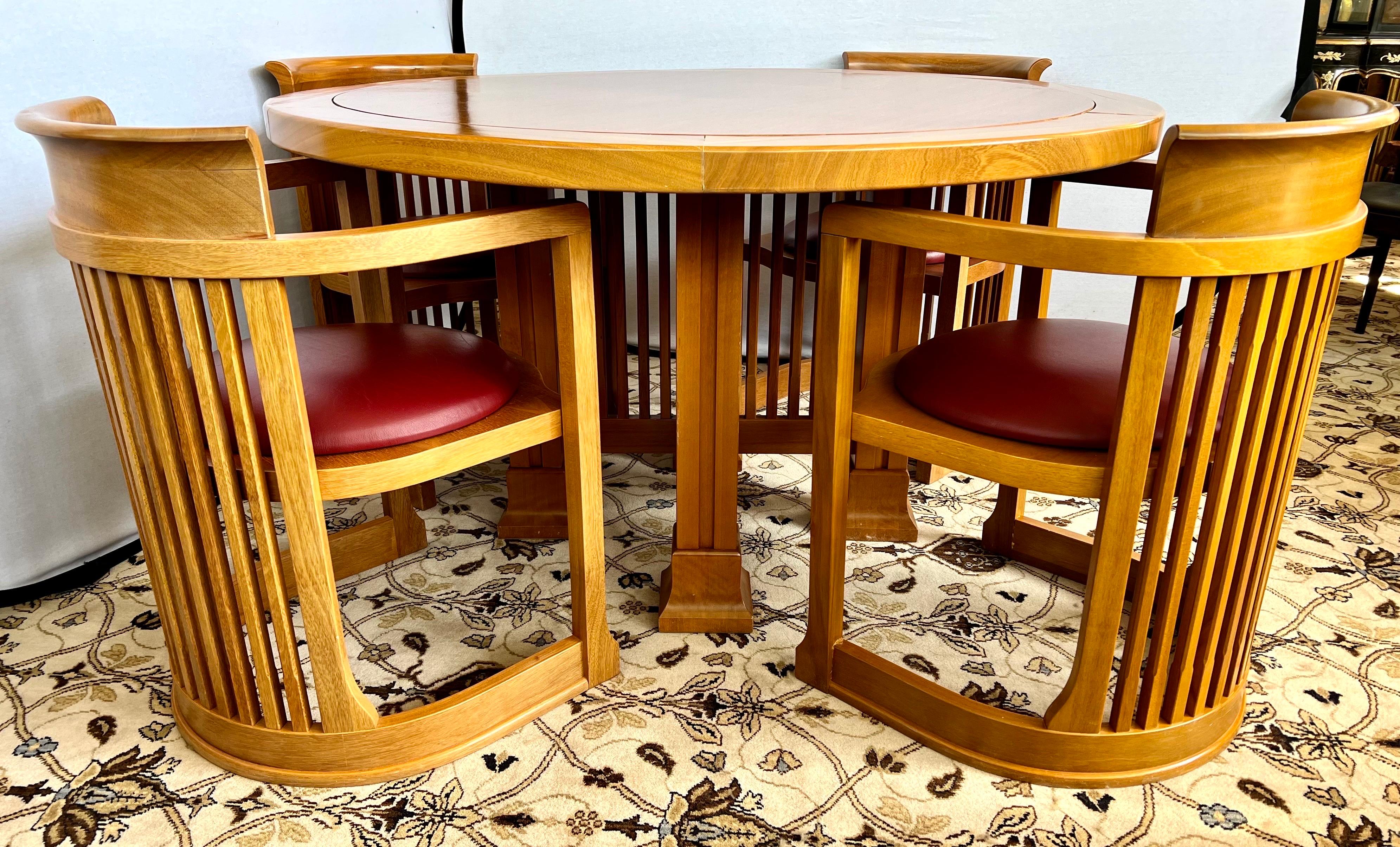 Exceptional five piece dining room set designed by Frank Lloyd Wright in 1937, relaunched in 1986. Manufactured by Cassina in Italy. The table is round as shown and is surrounded by four matching barrel chairs.
A timeless design informed by