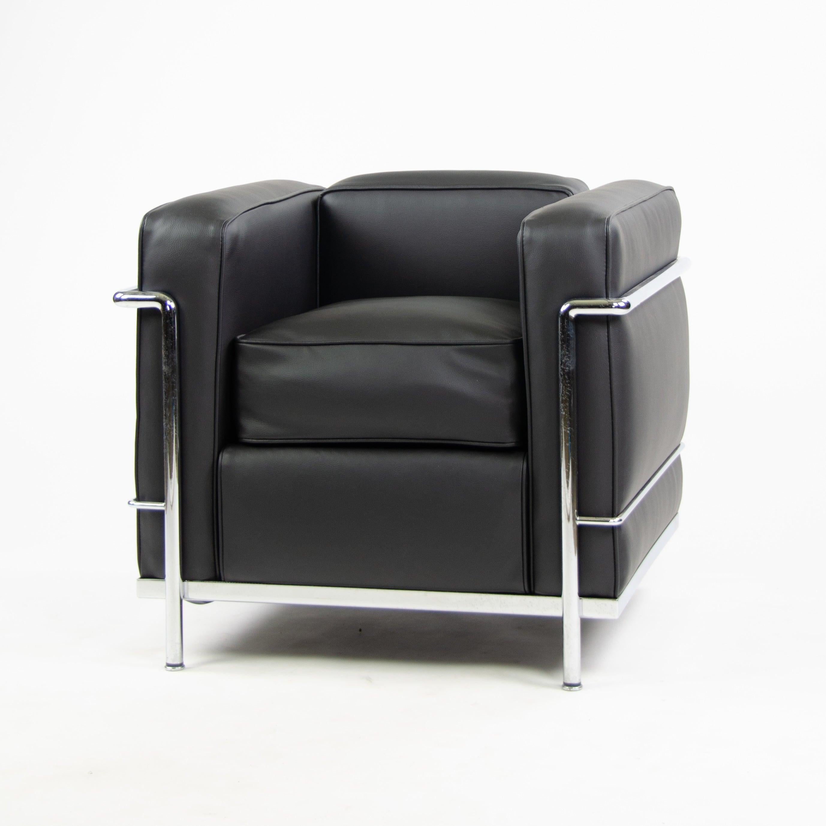 Listed for sale is a beautiful and original LC2 Petit Modele armchair by Cassina with new and gorgeous black upholstery. This series was designed most famously by Le Corbusier, along with his collaborators Pierre Jeanneret and Charlotte