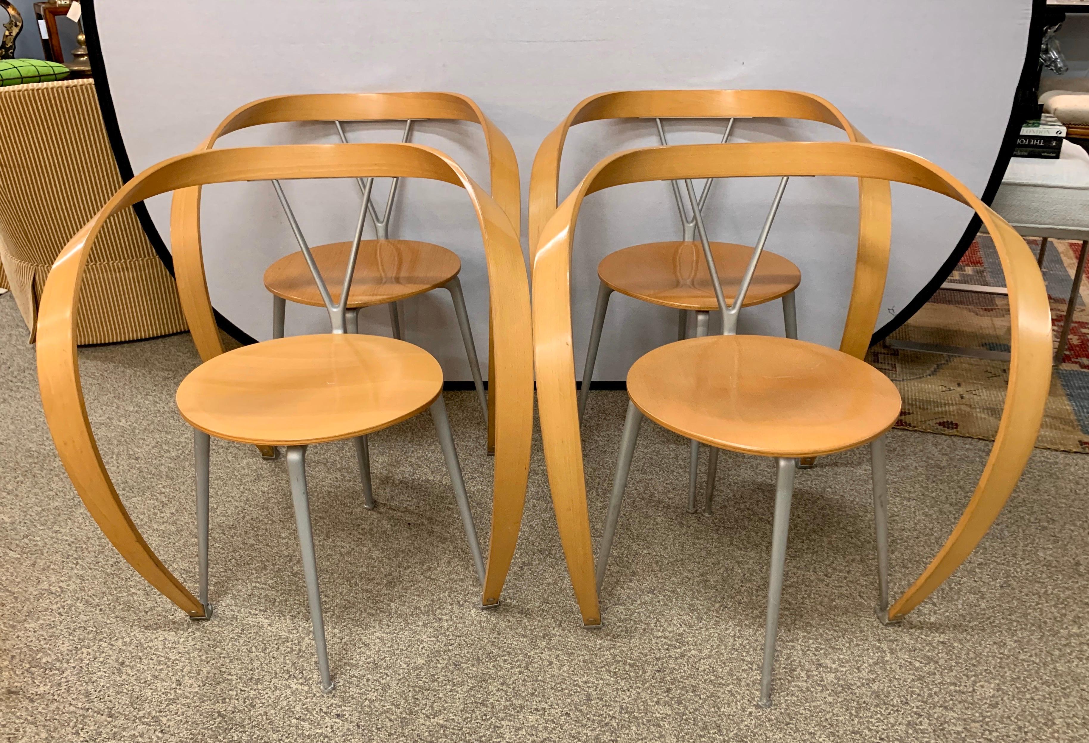 Andrea Branzi designed these chairs for Cassina in the early 1990s and they instantly became
a classic. Known as the Revers chairs, they look like sculptural works of art. The wood is beechwood
and they are supported metal as shown. They are in