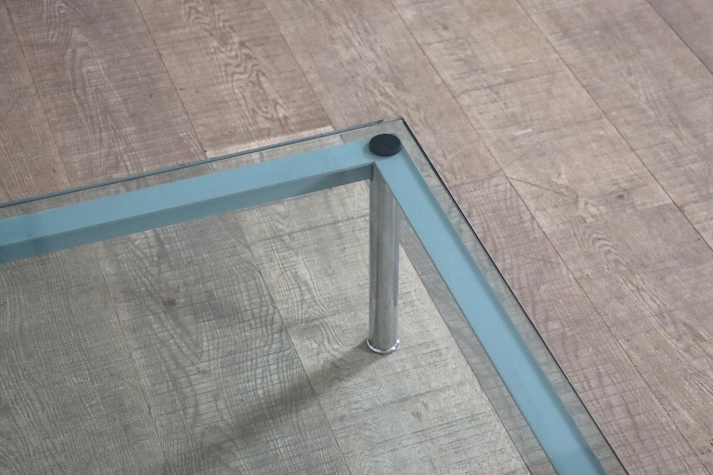 Beautiful LC10 coffee table by Le Corbusier, Pierre Jeanneret, and Charlotte Perriand, 1928. Crafted with high quality materials in the 1980s by renowned Italian manufacturer Cassina. Featuring a sleek chrome-plated steel frame, light blue lacquered