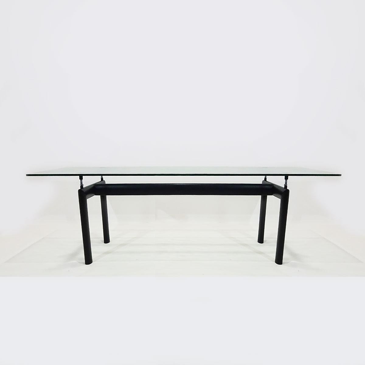 An original 6-8 seat black metal and textured glass vintage Cassina LC6 table originally designed in 1928 by Le Corbusier, Pierre Jeanneret and Charlotte Perriand.

Born in Switzerland in 1887 Charles-Édouard Jeanneret, known as Le Corbusier, is