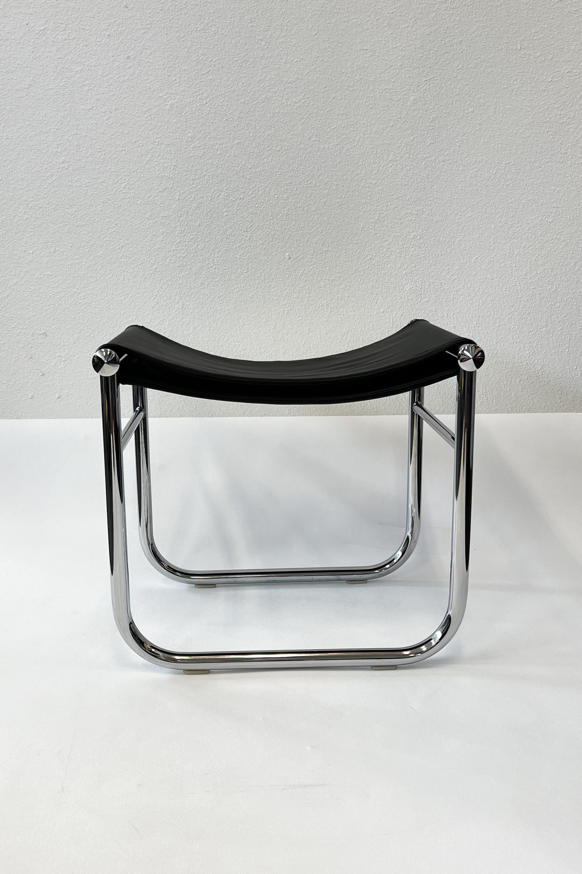  Le Corbusier LC9 Stool Leather was designed in the year 1927 by Le Corbusier, Pierre Jeanneret and Charlotte Perriand for Cassina. 

This one is constructed of polish chrome tubular frame with a soft black leather sling seat. 
Not sure of age, it