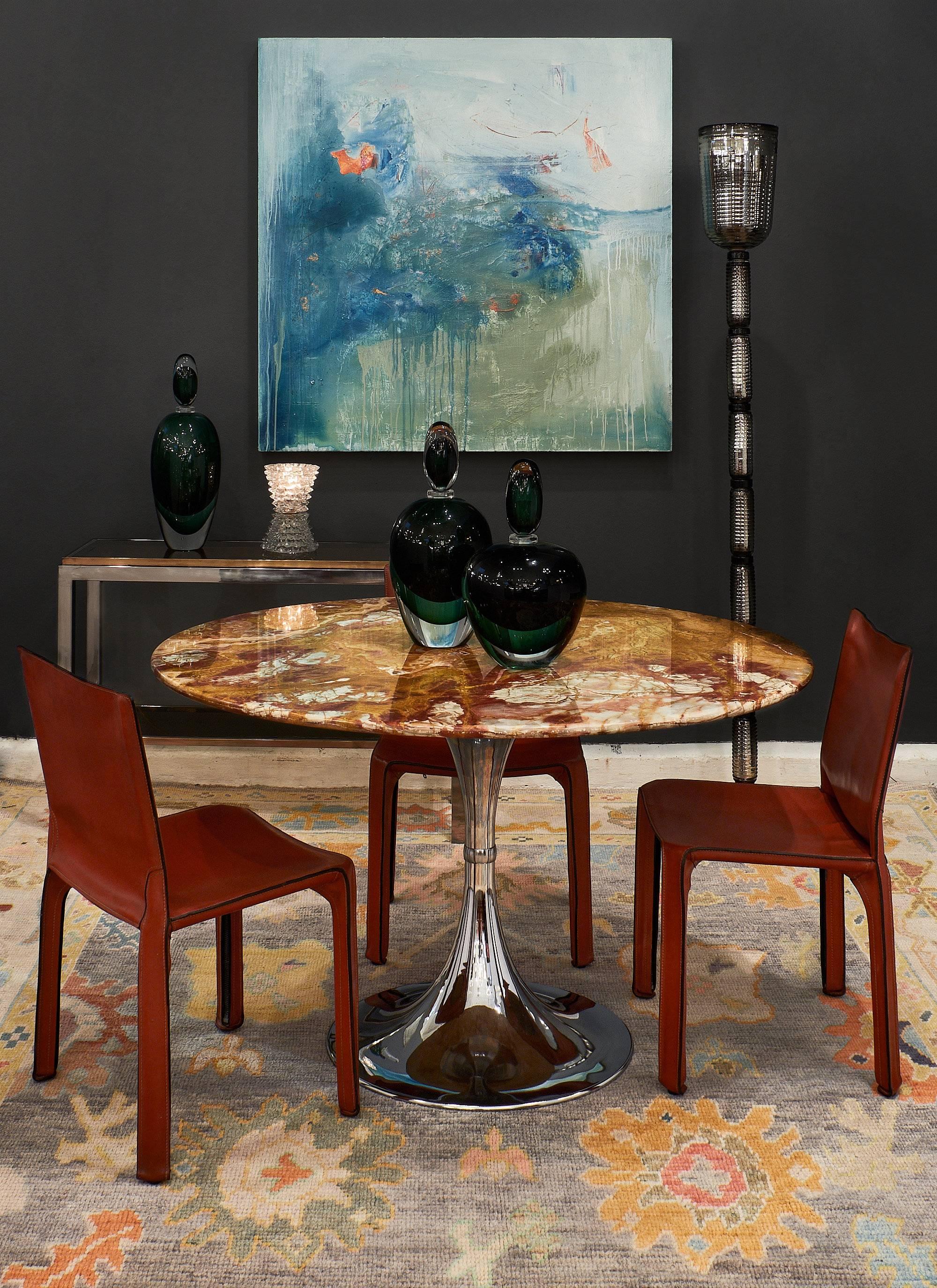Rare set of six leather dining chairs by Cassina. The great, strong structures are fully wrapped with beautiful bright red leather, perfectly patinated. There is stitching all around in fine shape.