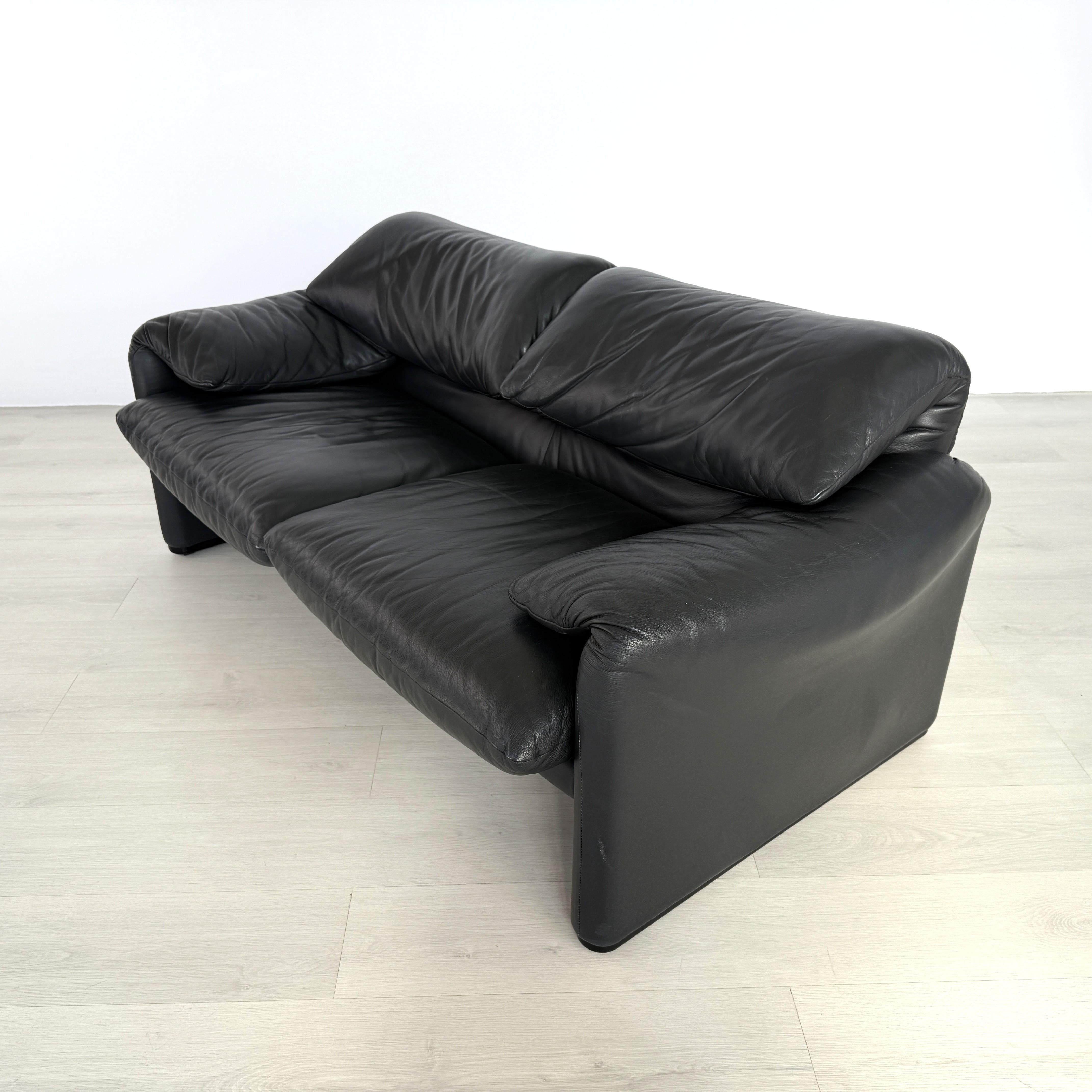 Dimensions: H 27.5” x W 68” x D 35” x SH 18”

Italian black leather 2-seater sofa, designed by Vico Magistretti for Cassina Maralunga from 1970s with practical foldable headrest. In excellent vintage condition.


Please see our other listings for