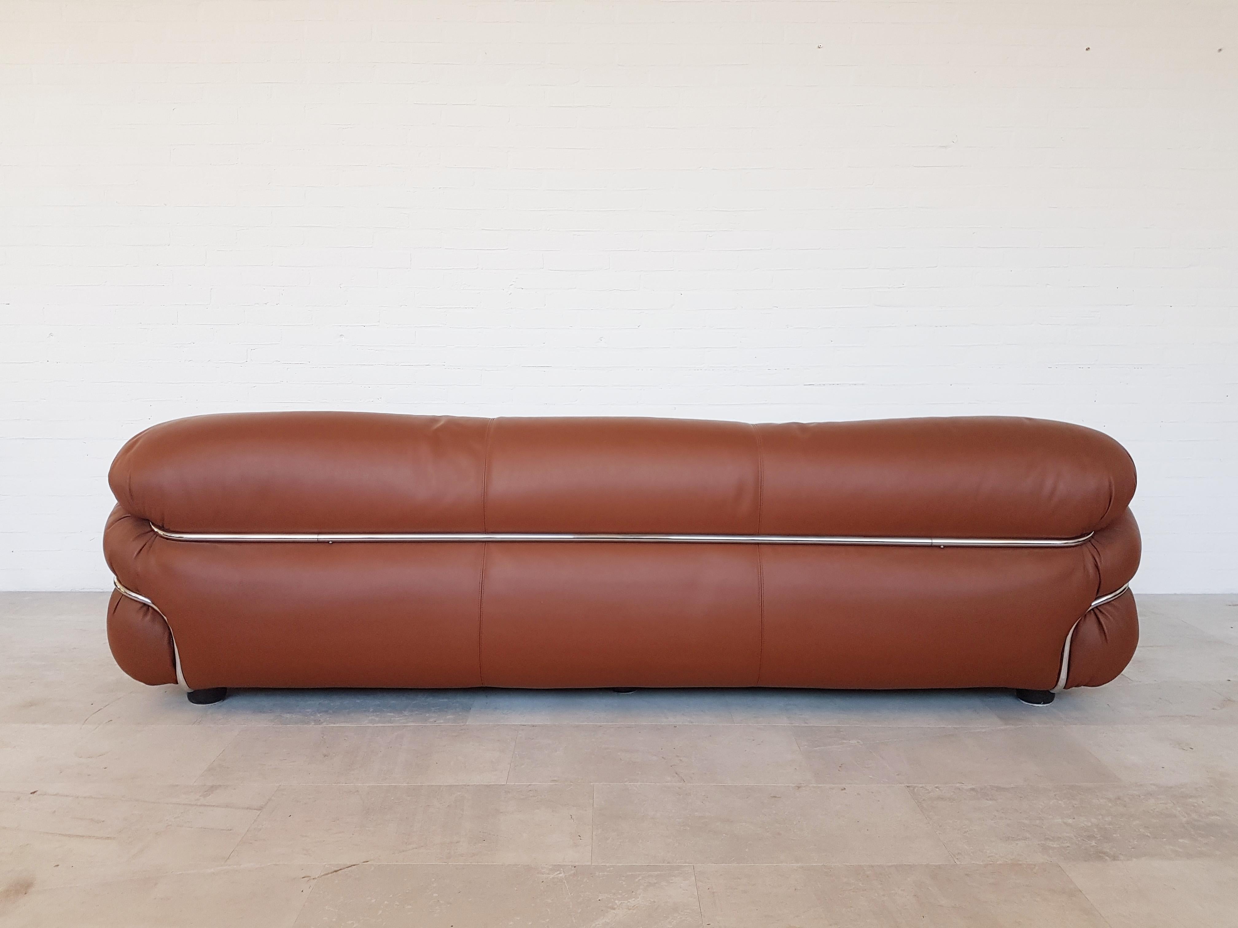Gianfranco Frattini designed this awesome Space Age piece in the 1970s for Cassina.
A three-seat sofa in cognac / whiskey colored leather and a chrome frame.
Would fit well in a mad men inspired interior.