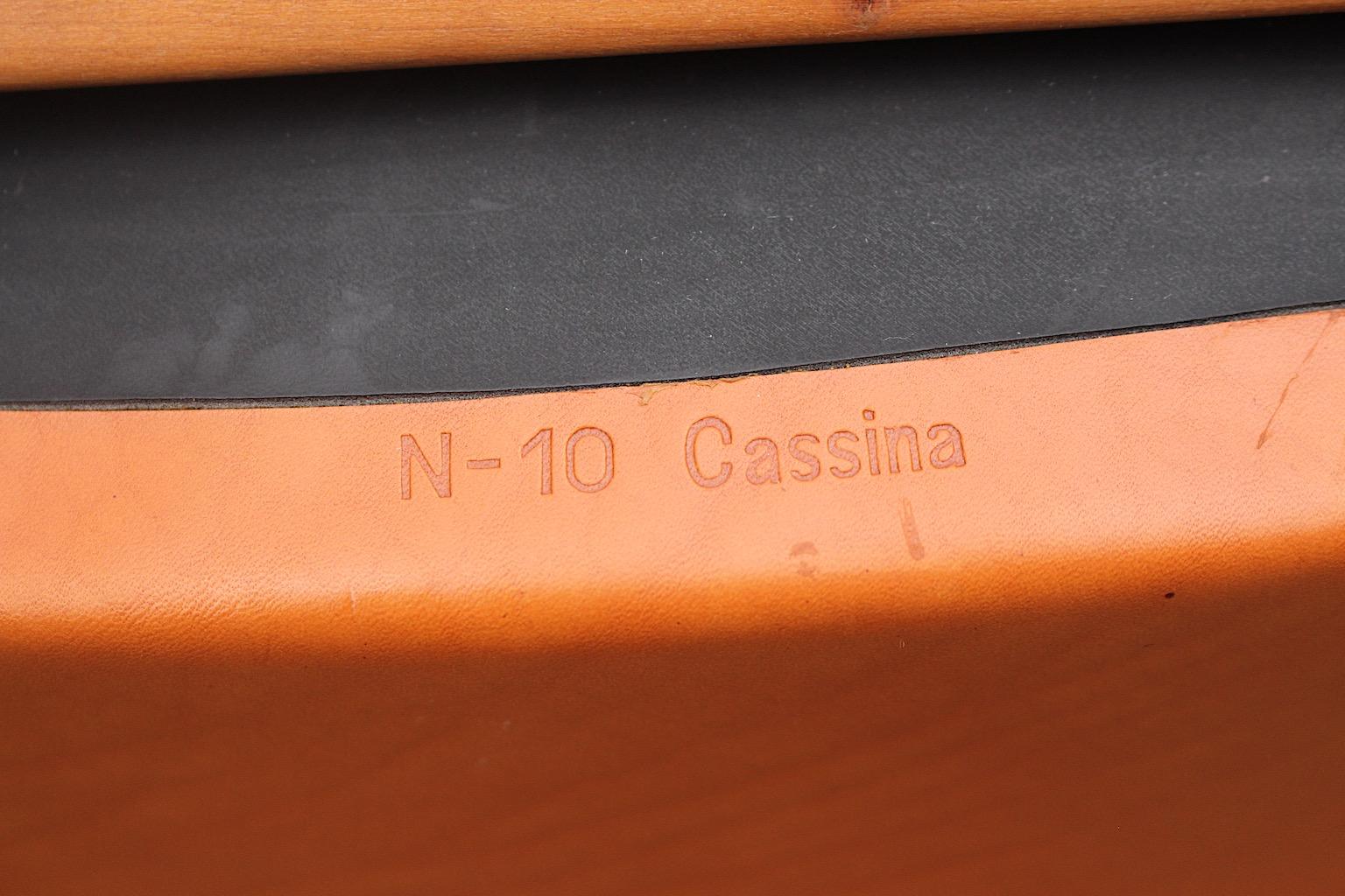 Modern set of 7 vintage dining chairs or armchairs made from a wooden base and a cognac brown leather armchair shell.
A great set of seven ( 7 ) dining chairs with armrests stamped with company label Cassina - N 10 from Josep Llusca for Cassina.
The