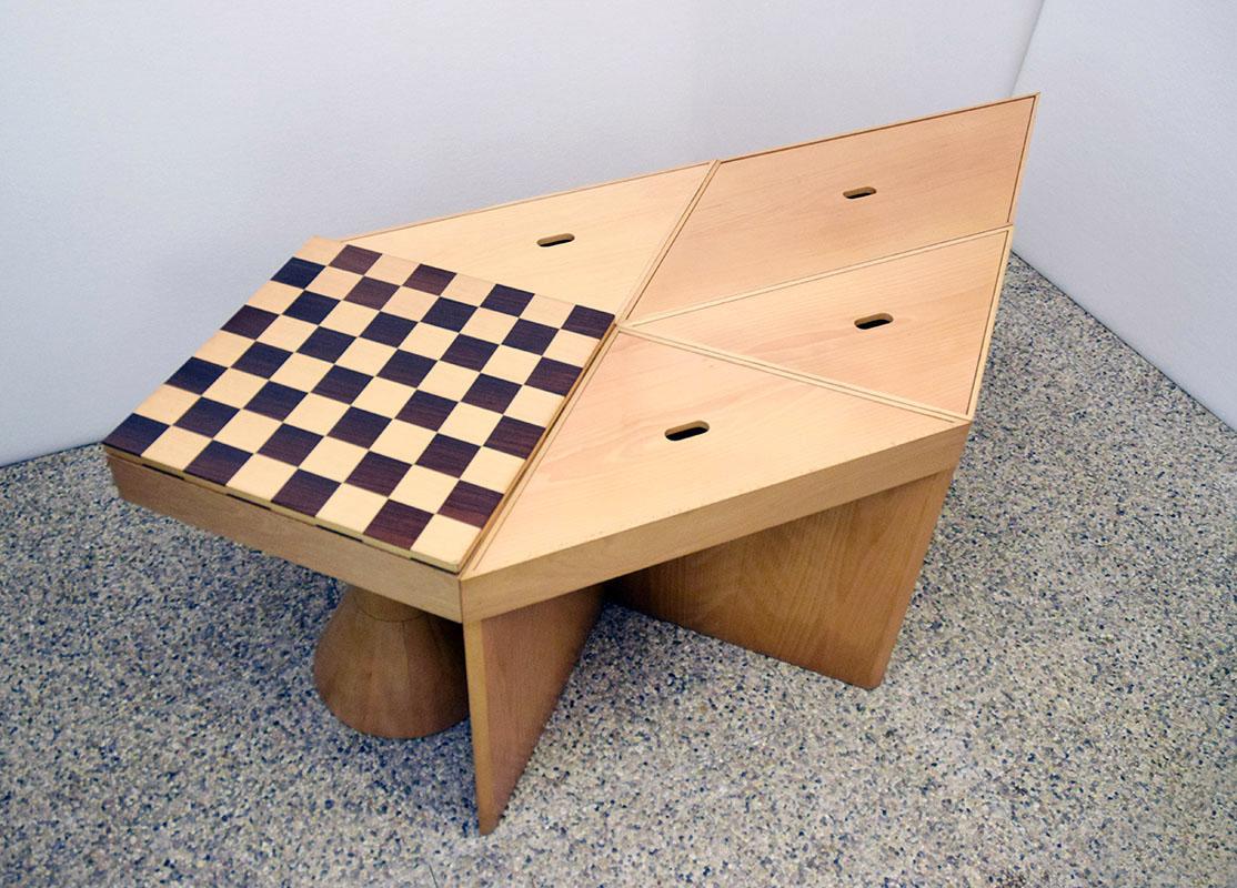 Modular table Mod.Tangram design Massimo Morozzi for Cassina 1980s.
Composed of 5 arrangeable elements in beech wood, one element with chessboard decoration and central foot.
All modules can be opened with storage compartment, possibile to use also
