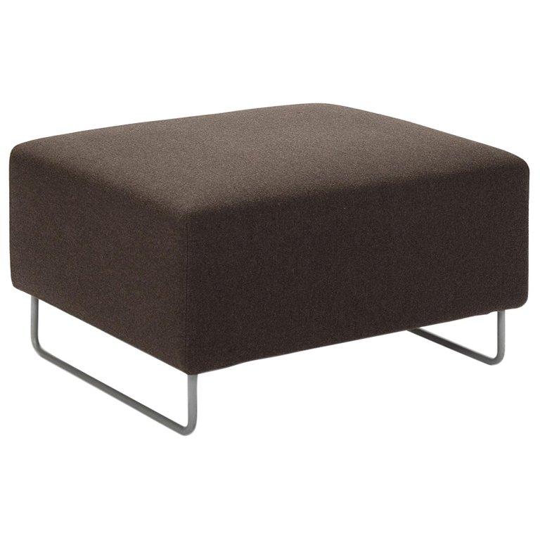 This ottoman has tonal stitching and gray lacquered steel legs. The fabric is Saville by Cassina and is a grey/brown wool, polyamide and cashmere.