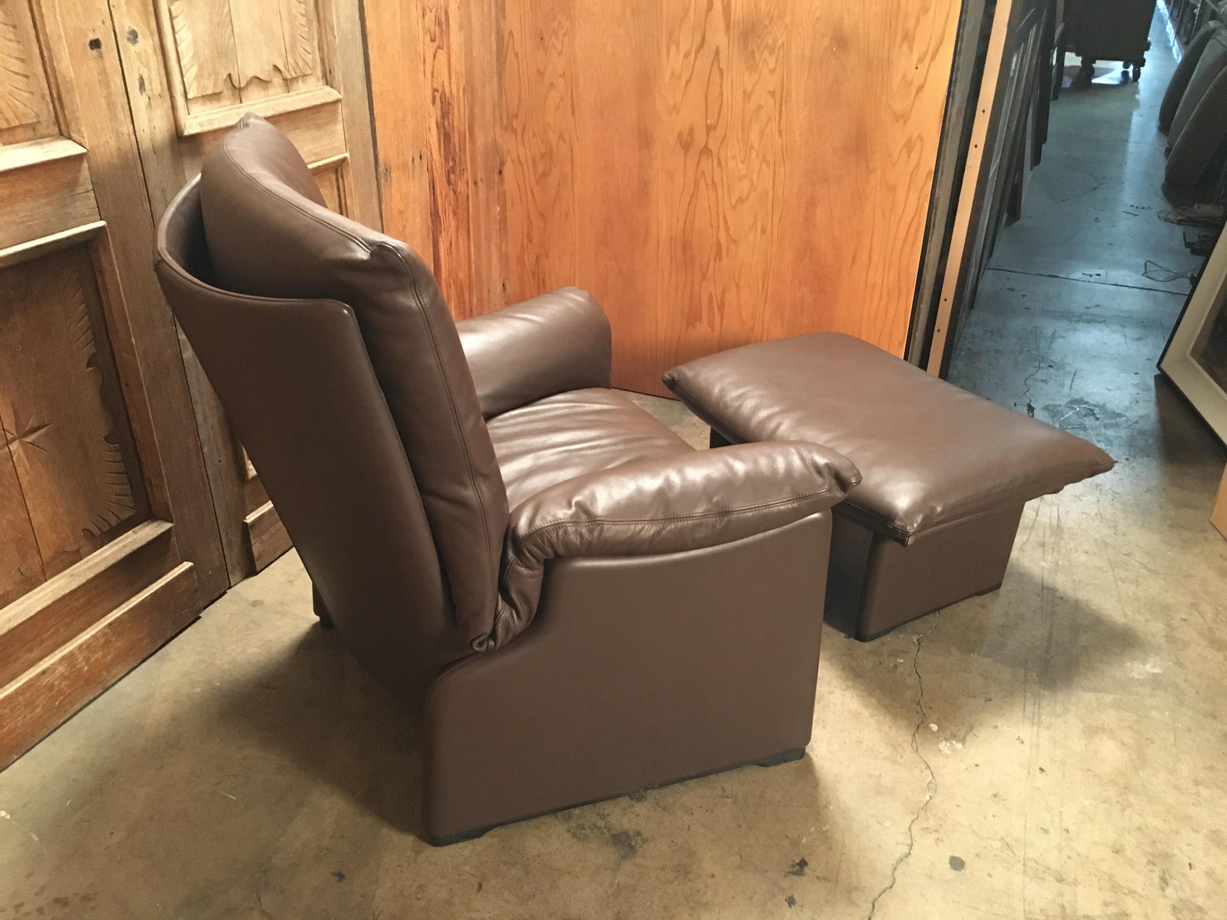 Thick chocolate brown leather lounge chair and ottoman designed by Vico Magistretti
Chair measures 36.5
