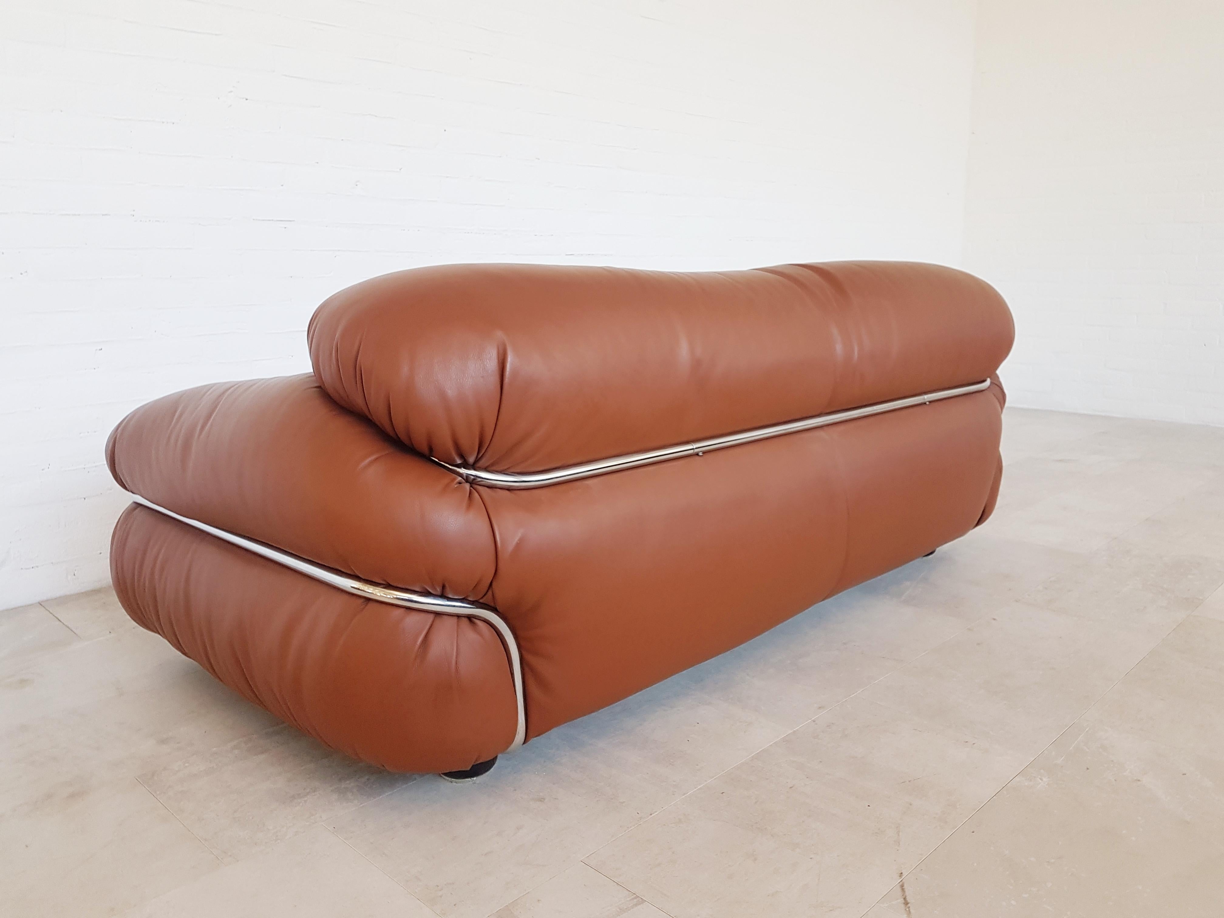 Gianfranco Frattini designed this awesome Space Age piece in the 1970s for Cassina. A sofa in cognac / whiskey colored leather and a chrome frame. Would fit well in a mad men inspired interior.