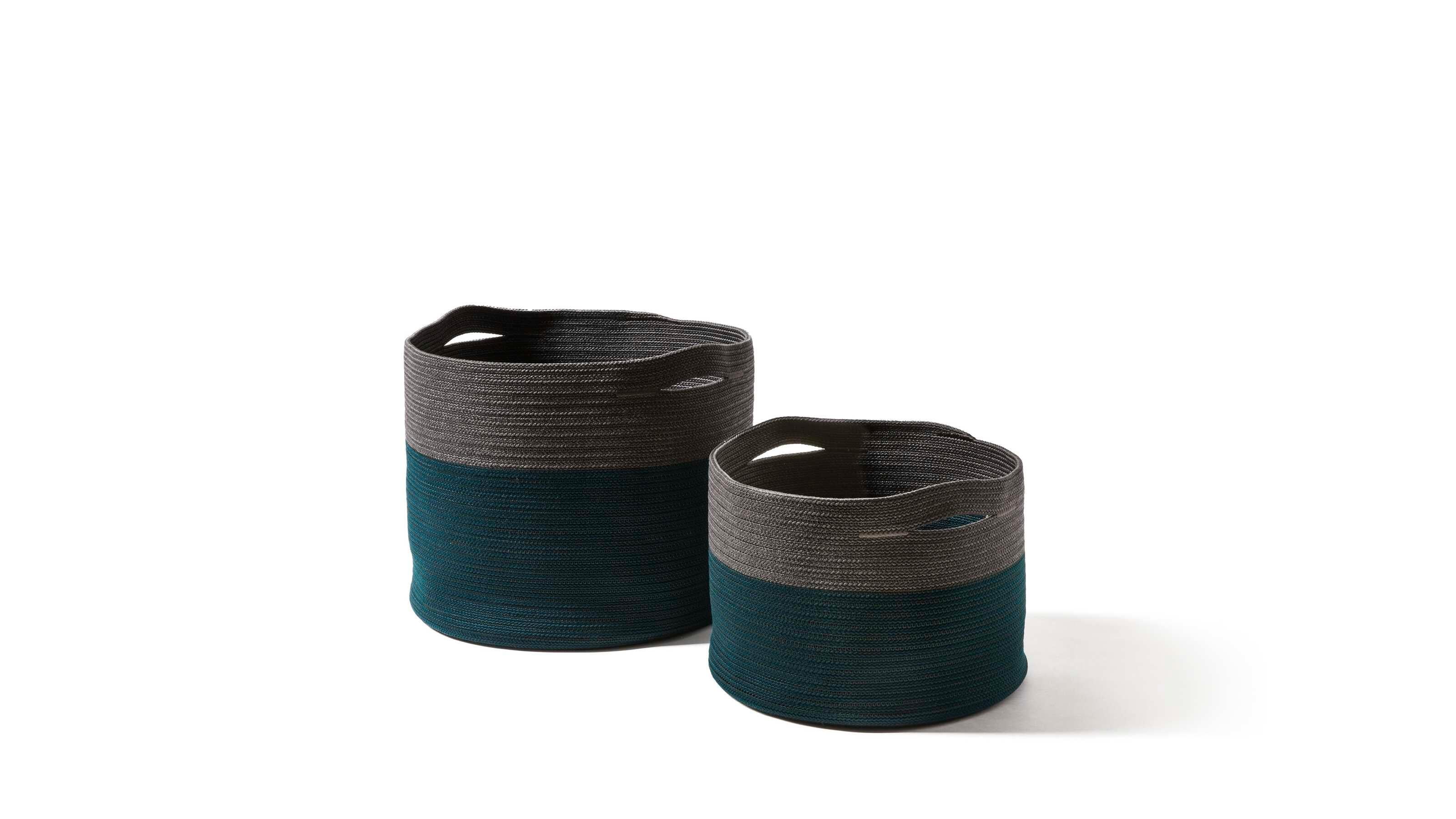 Cassina Set of Two Podor Outdoor Accessories 

Outdoor accessories complete the Cassina lineup of furnishings for open-air living and dining areas. The baskets are inspired by the shapes and brilliant colors of the wicker baskets made by African
