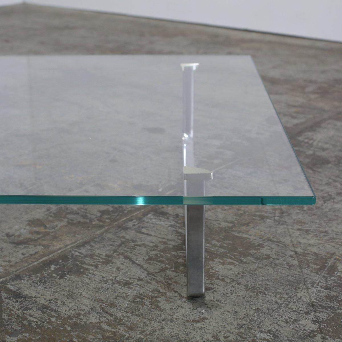 Designed by the legendary Piero Lissoni, the Cassina Toot Coffee Table is a triumph of understated modernism. This versatile piece, produced by the esteemed Italian manufacturer, features a sleek, minimalist frame with a chrome finish. Contrasting