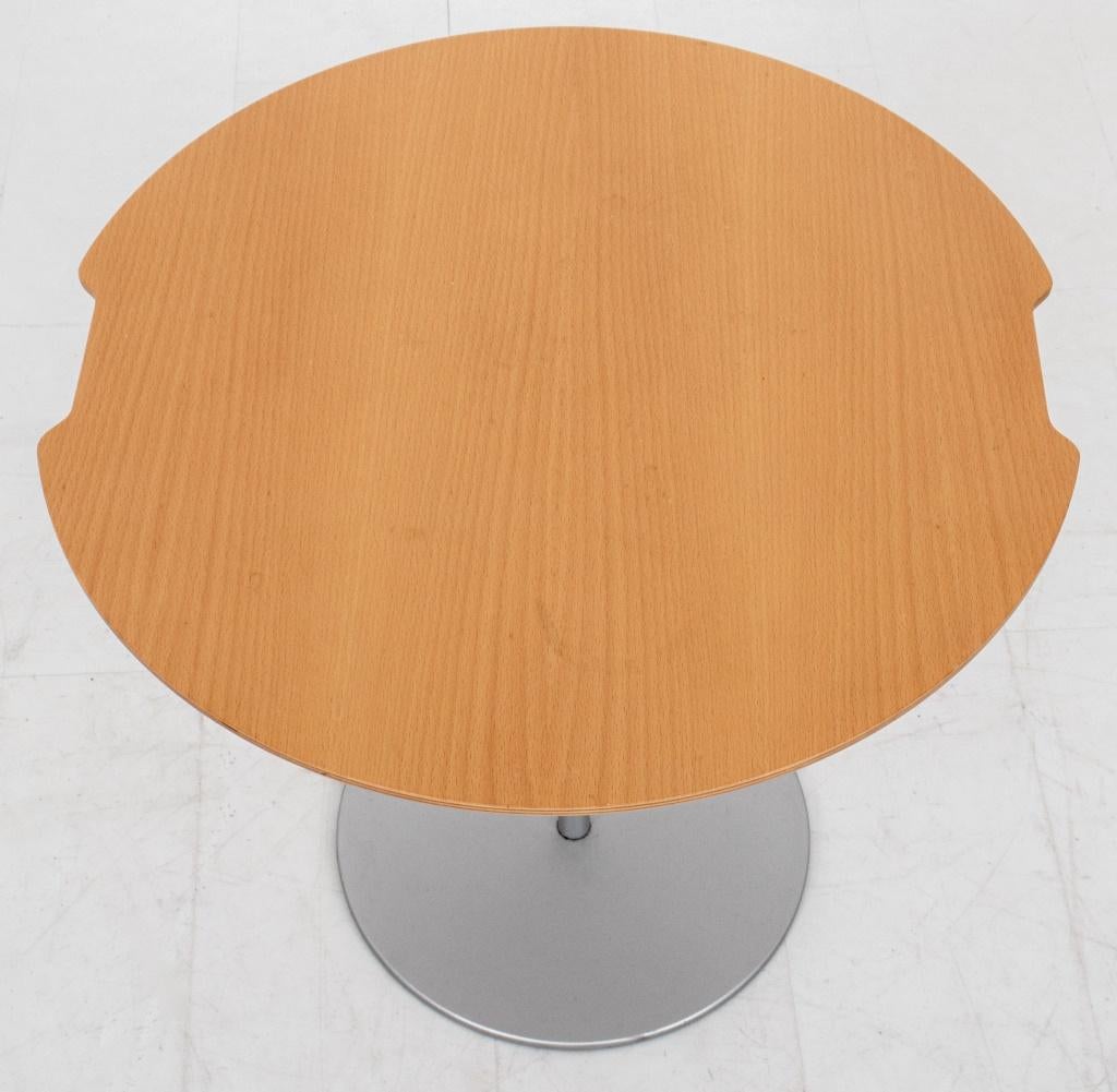 Cassina cherry wood and steel side table, circa 20th century, with shaped circular top above a support on circular steel base.

Dealer: S138XX