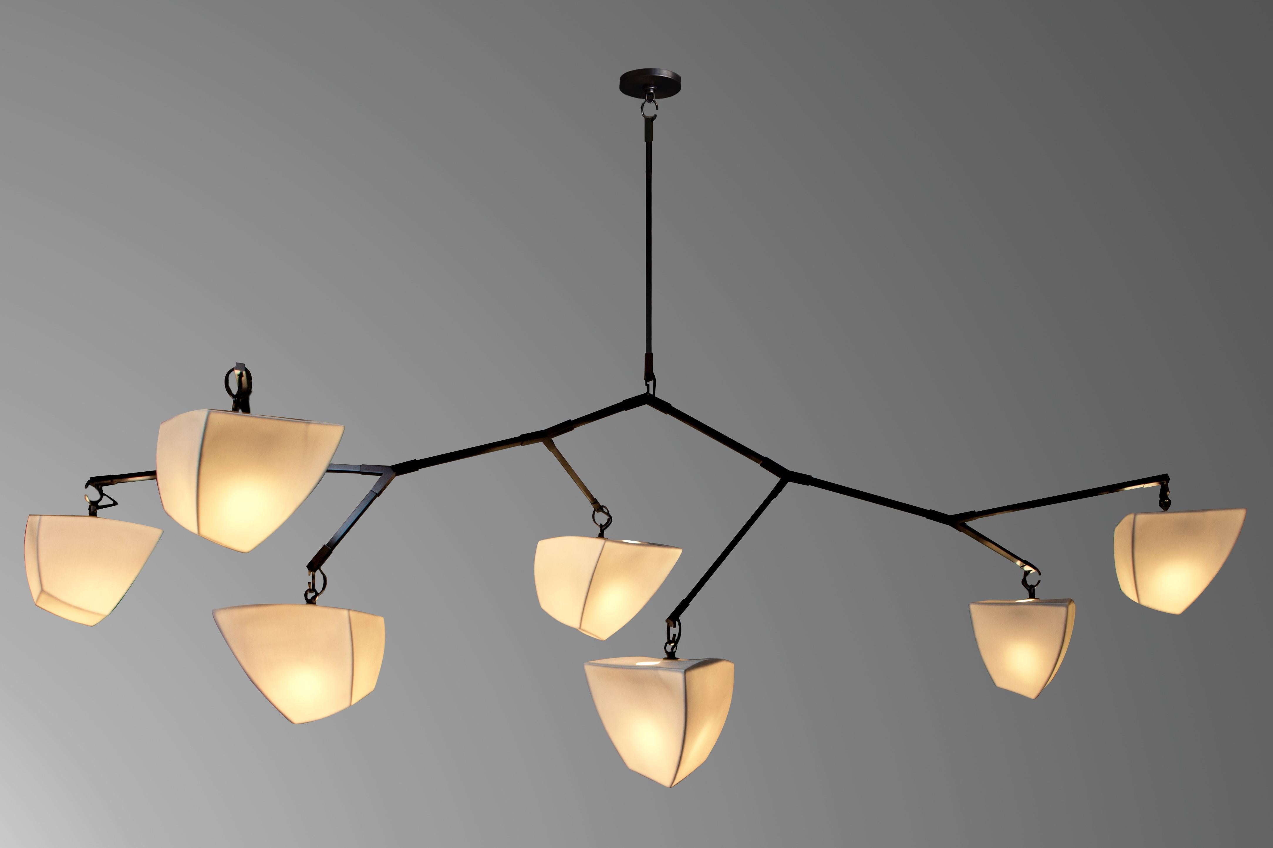 This is a horizontal mobile chandelier with 7 glowing cast porcelain polyhedrons. 
Also available with bamboo polyhedrons.

The Cassiopeia series was designed for spaces with lower ceiling heights where a horizontal chandelier is needed.  

Our