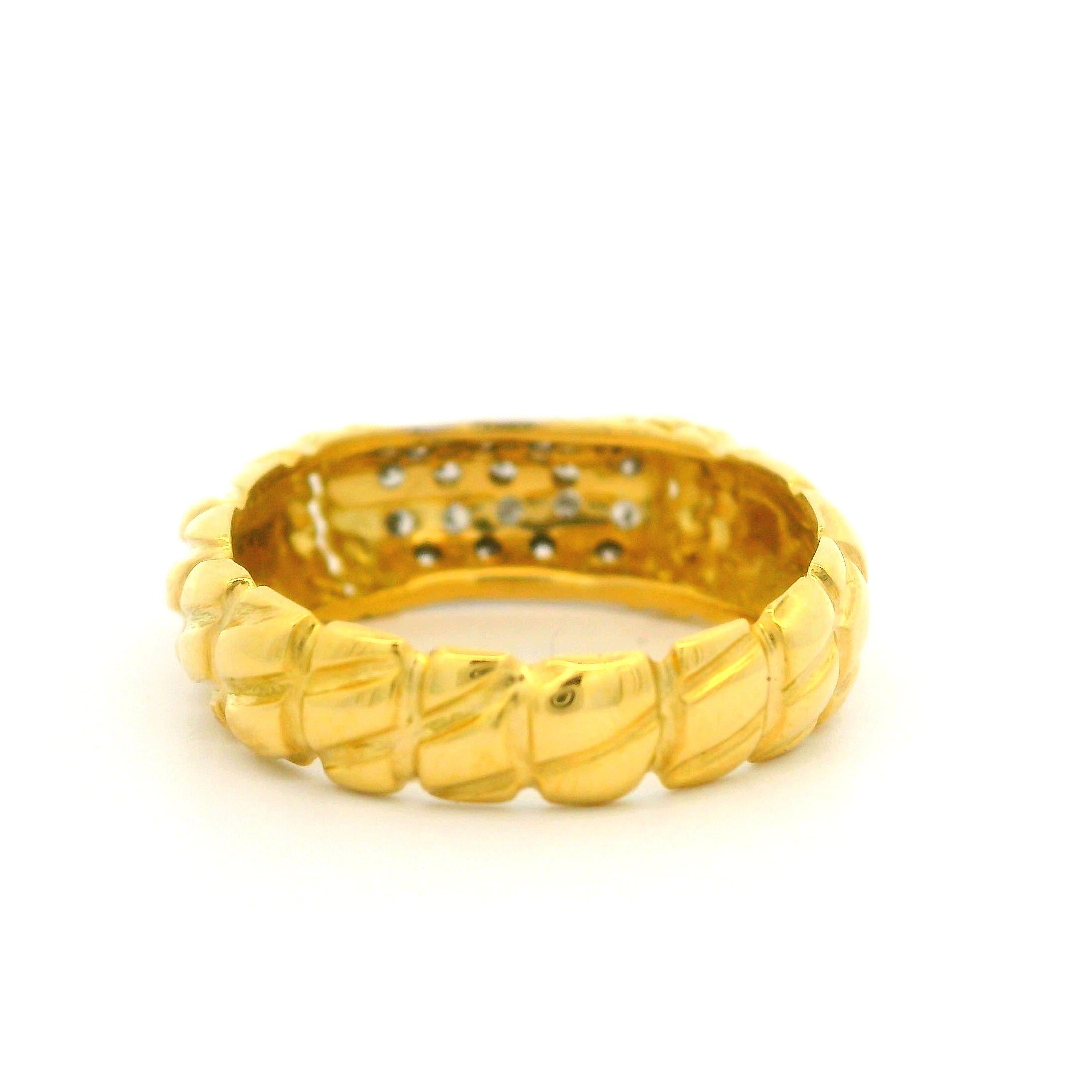 –Stone(s)–
(18) Natural Genuine Diamond - Round Brilliant Cut - Pave Set - F-H Color  - VS1-VS2 Clarity - 0.15-0.20ctw (approx.)

Material: Solid 18k Yellow Gold
Weight: 4.48 Grams
Ring Size: 6.0 ( fitted on finger, please contact us prior to