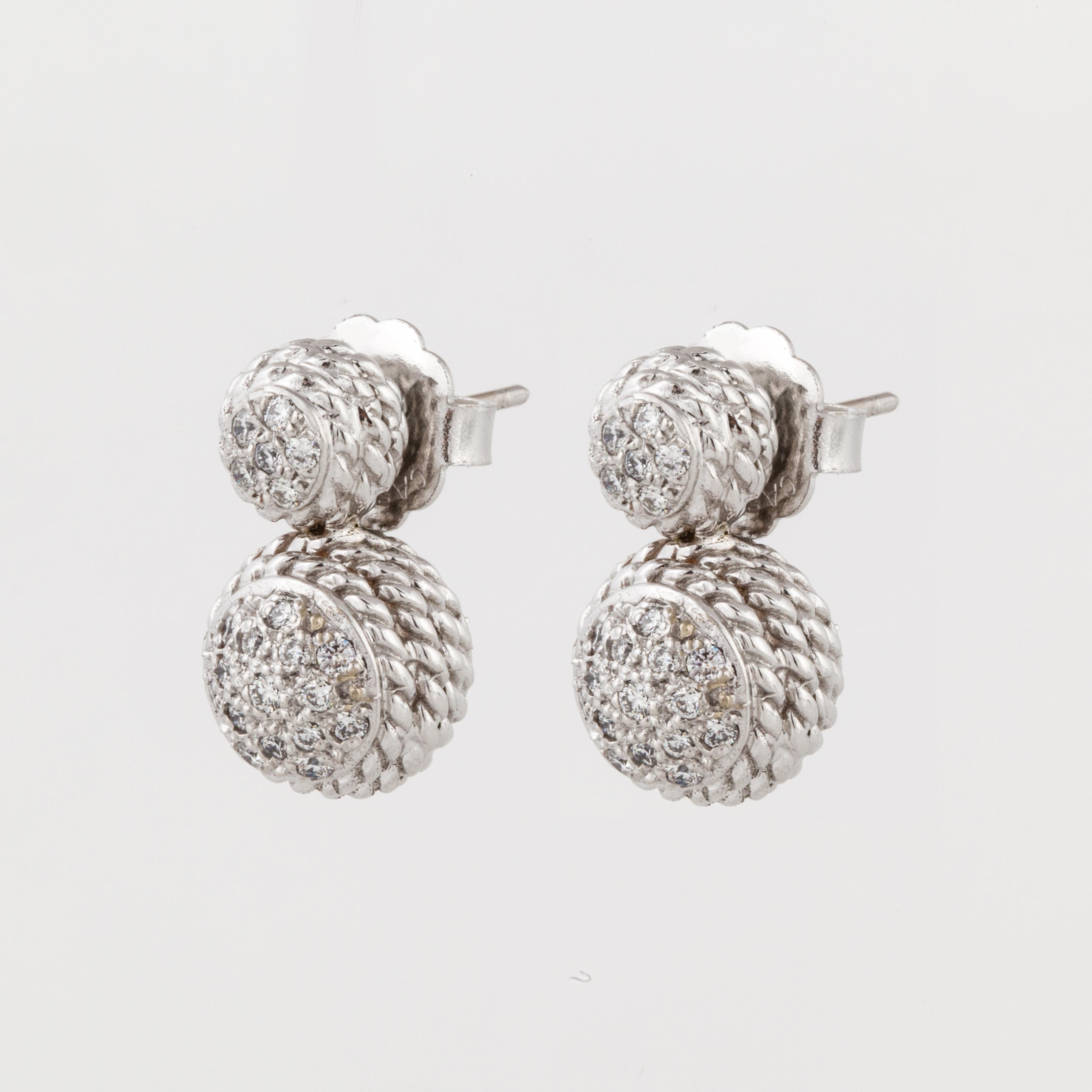 18K white gold earrings by Cassis.  The design features small rope made into spheres and accented with round diamonds. There are seventy-two round diamonds that total 1 carat, G-H color and VS clarity.  They measure 3/4 inches long and 3/8 inches