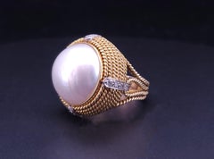 Cassis white pearl and diamond cocktail ring set in 18k yellow gold.