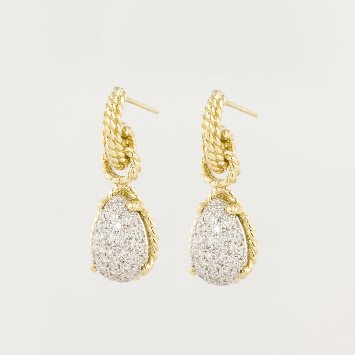 18K yellow gold earrings by Cassis.  The bottom dangle is a pear shape with pave diamonds.  There are eighty-two round diamonds that total 1.25 carats, G-H color and VS clarity.  They measure 1 1/4 inches long and 1/2 inch wide.  The earrings have