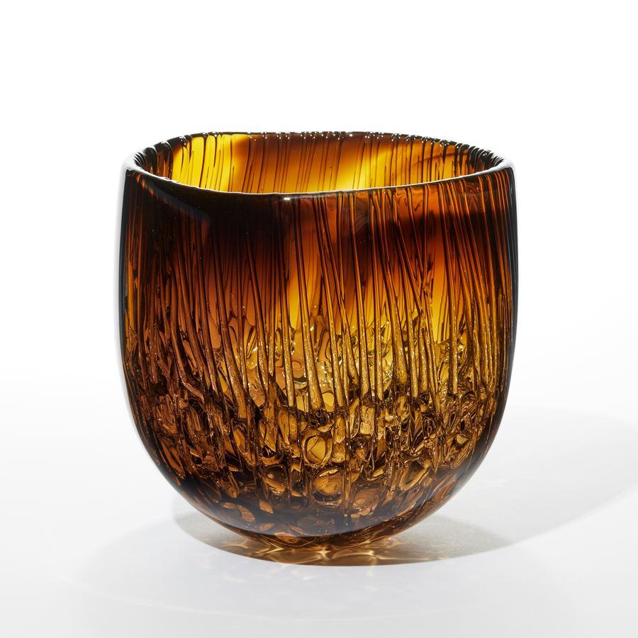 'Cassito in Aurora Gelb & Rauch Topaz' is a unique handblown and sculpted decorative glass centrepiece by the British artist, Katherine Huskie.

An early introduction to glass at college saw Katherine Huskie go on to study glass and ceramics at the