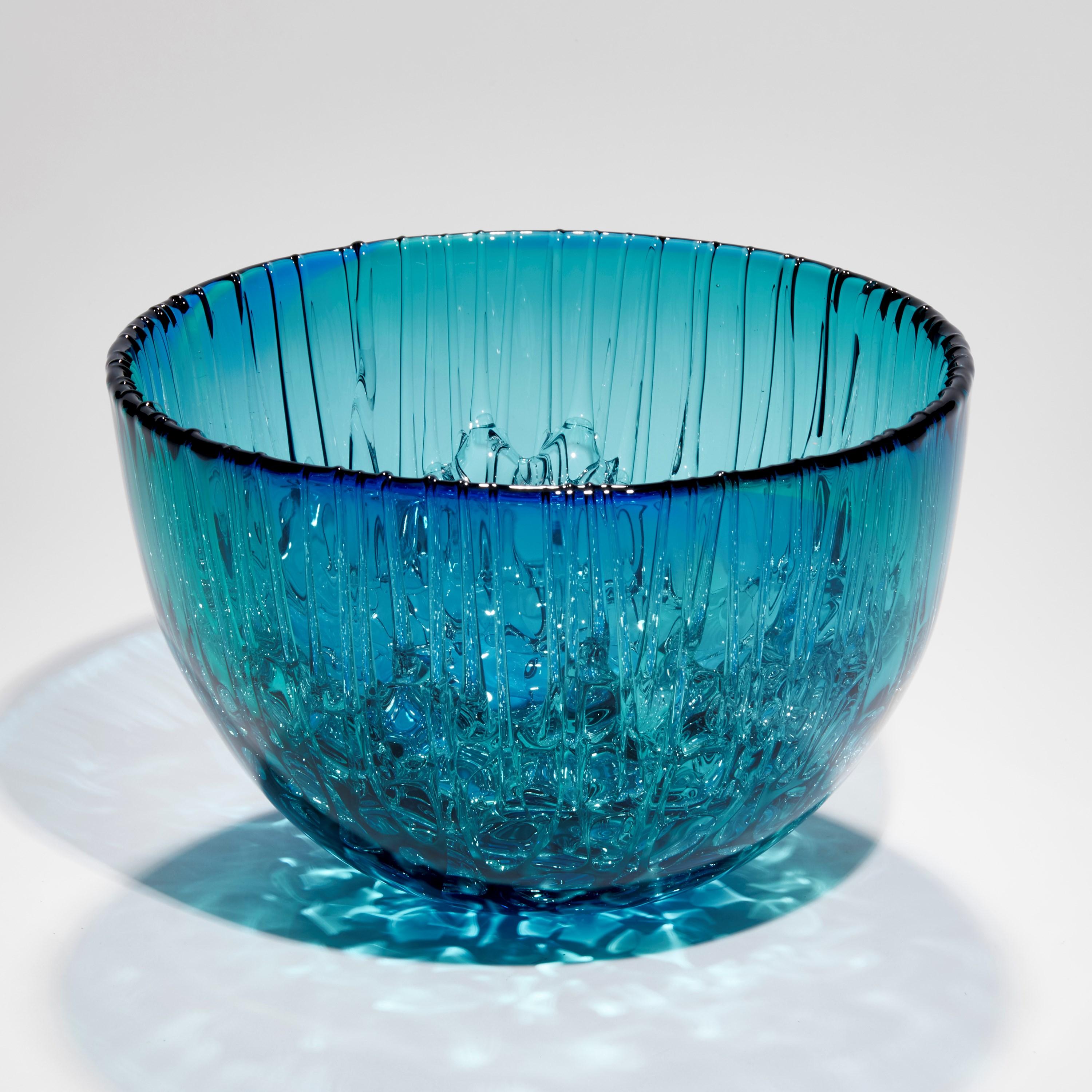 'Cassito in Blue & Green' is a unique handblown and sculpted decorative glass centrepiece by the British artist, Katherine Huskie.

Huskie's work has a strong identity with form, colour and especially pattern, taking inspiration from nature,