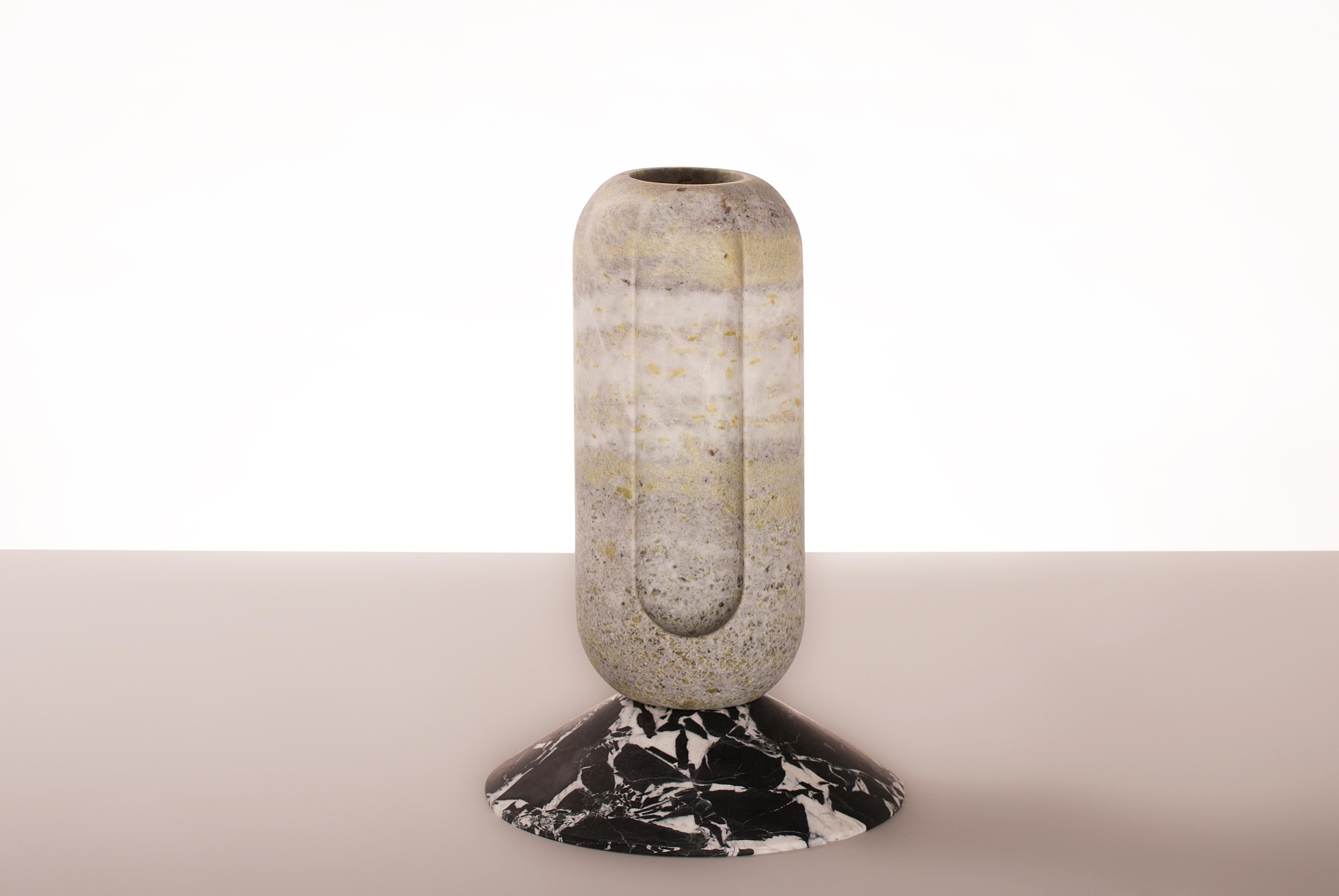 Cassus - Marble Contemporary Vase - Valentina Cameranesi
Materials: Noir Antique + Green Jade (Also available in White Carrara marble )
Dimensions: 36 x 24 x 24 cm.

The “Avalon” series consists of 3 sculptural vases, made of White Arabescato