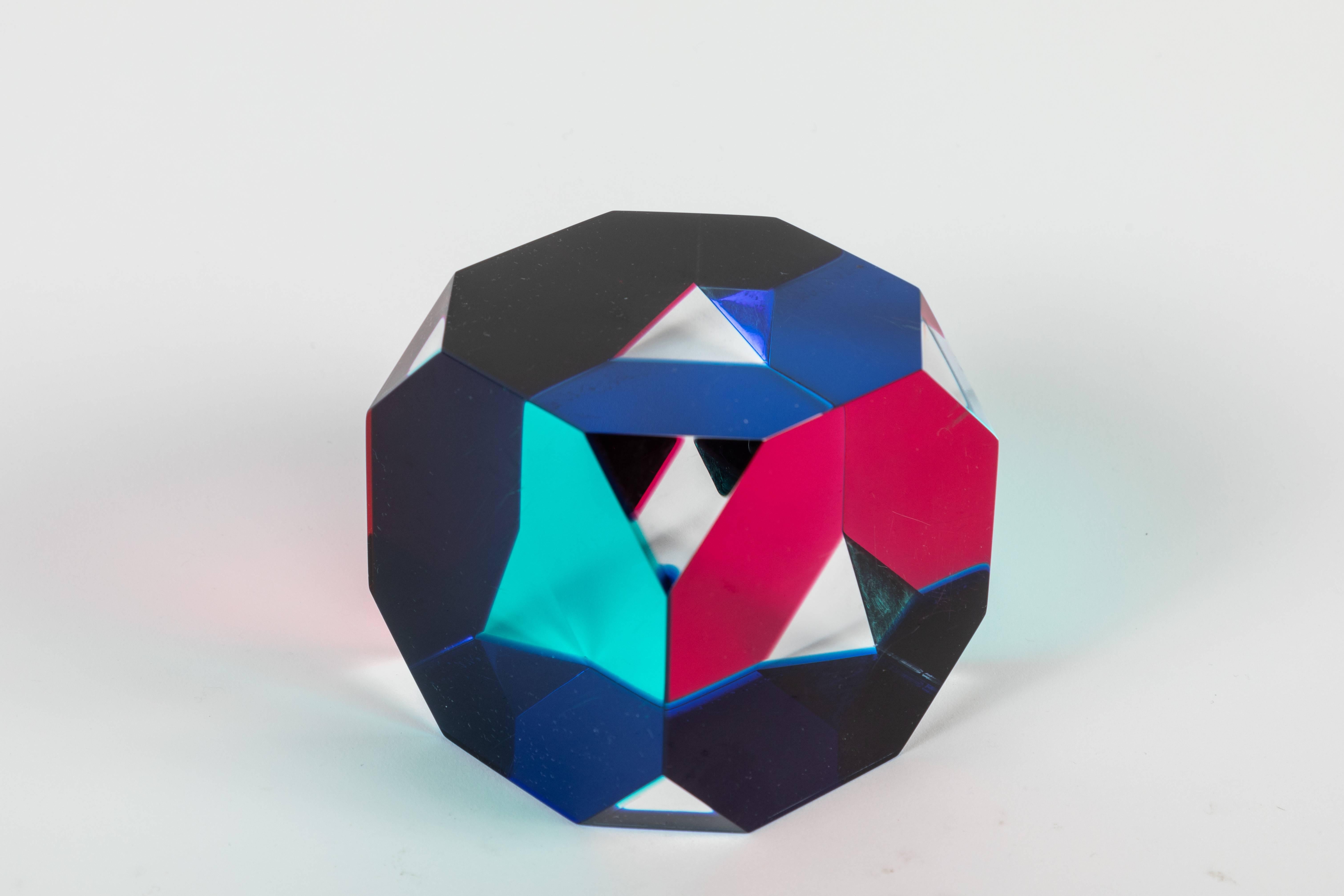 An abstract laminated cast acrylic octagonal cube sculpture by Vasa Velizar Mihich, AKA Vasa. Colors: blue, green, magenta, and clear.

Vasa is an internationally known painter and sculptor. His studio is located in Los Angeles,