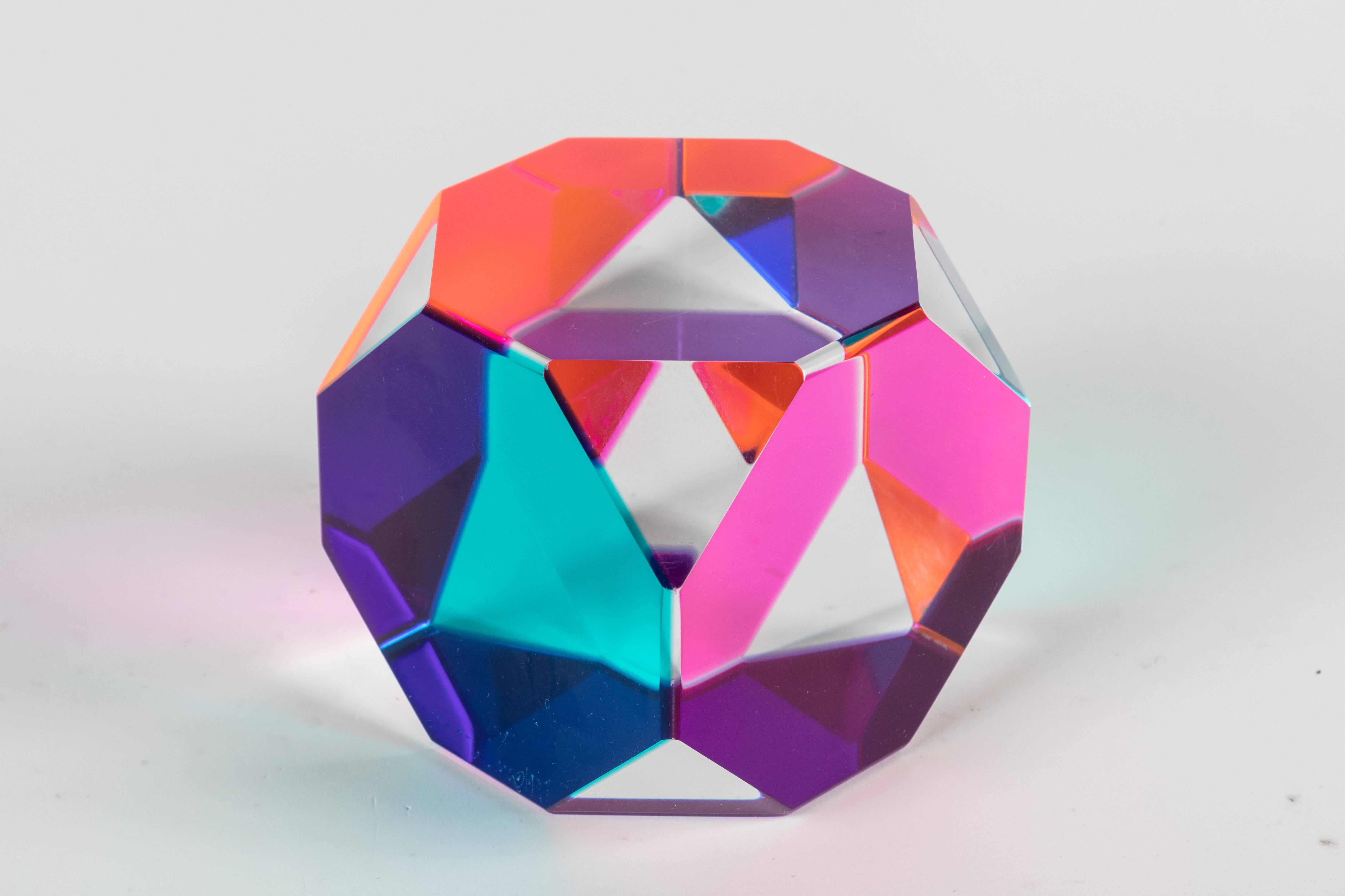 An abstract laminated cast acrylic octagonal cube sculpture by Vasa Velizar Mihich, AKA Vasa. Colors: blue, green, magenta, and clear.

Vasa is an internationally known painter and sculptor. His studio is located in Los Angeles,