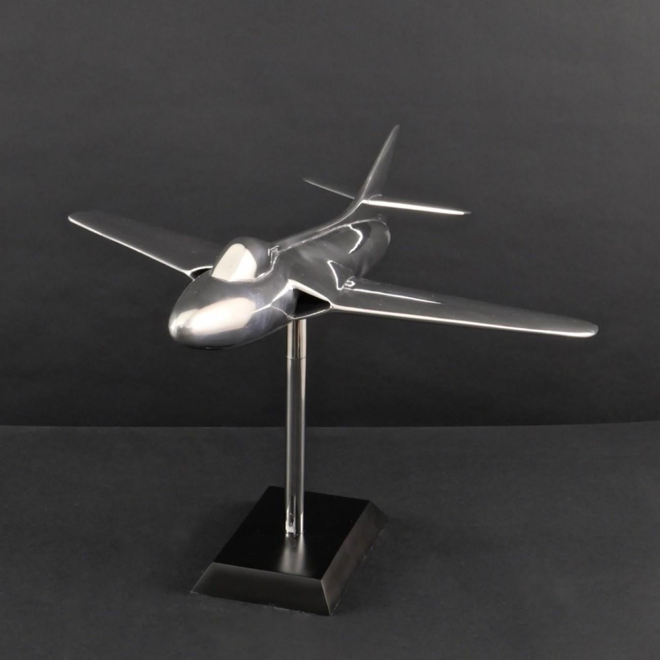 Wonderful cast aluminum scale model of a Hawker Hunter fighter jet on original Stand, made for the Air Ministry in the 1950s. The aircraft was originally painted, but the condition of the finish was beyond restoration so it has been stripped and